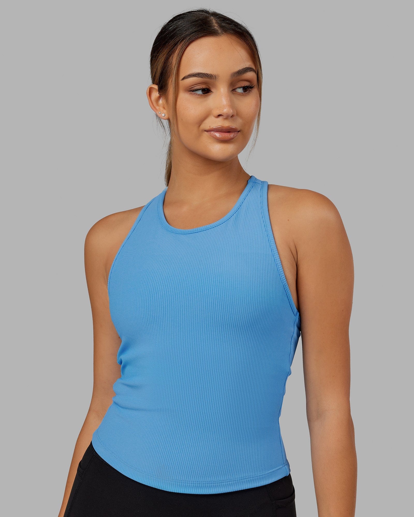 Model wearing Flow Ribbed Shelf Bra Performance Tank - Azure Blue