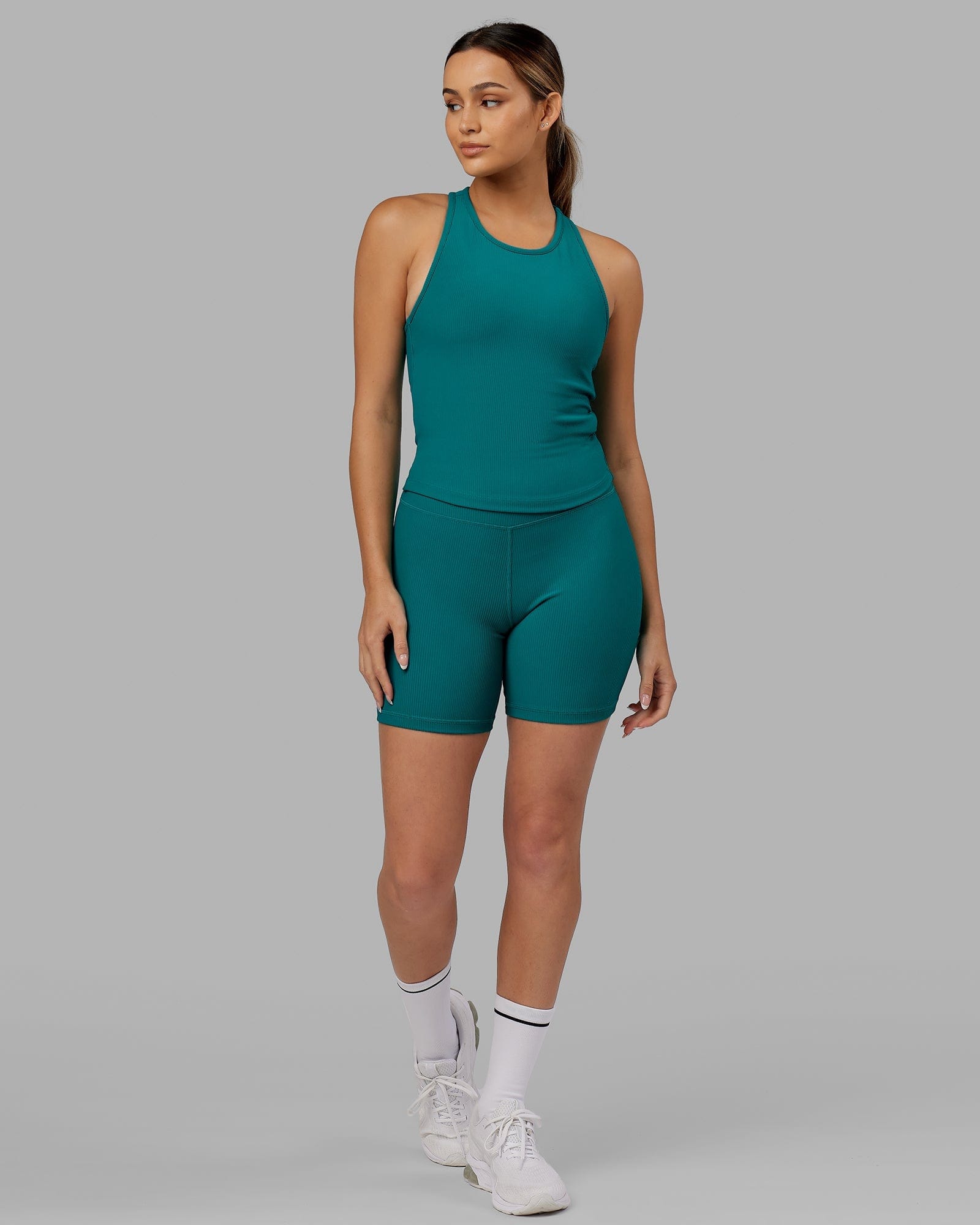 Model wearing Flow Ribbed Shelf Bra Performance Tank - Sea Green