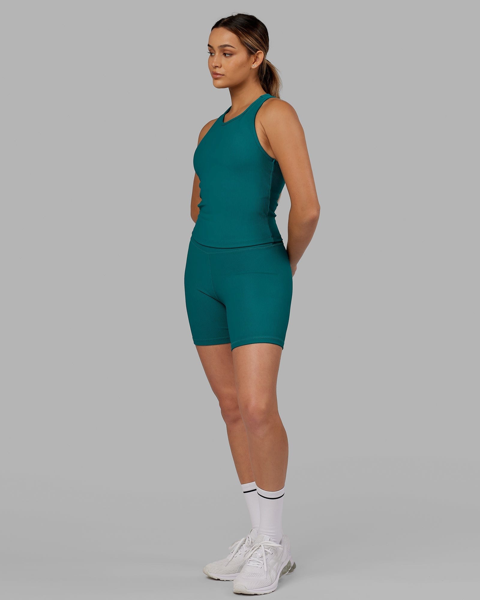 Model wearing Flow Ribbed Shelf Bra Performance Tank - Sea Green