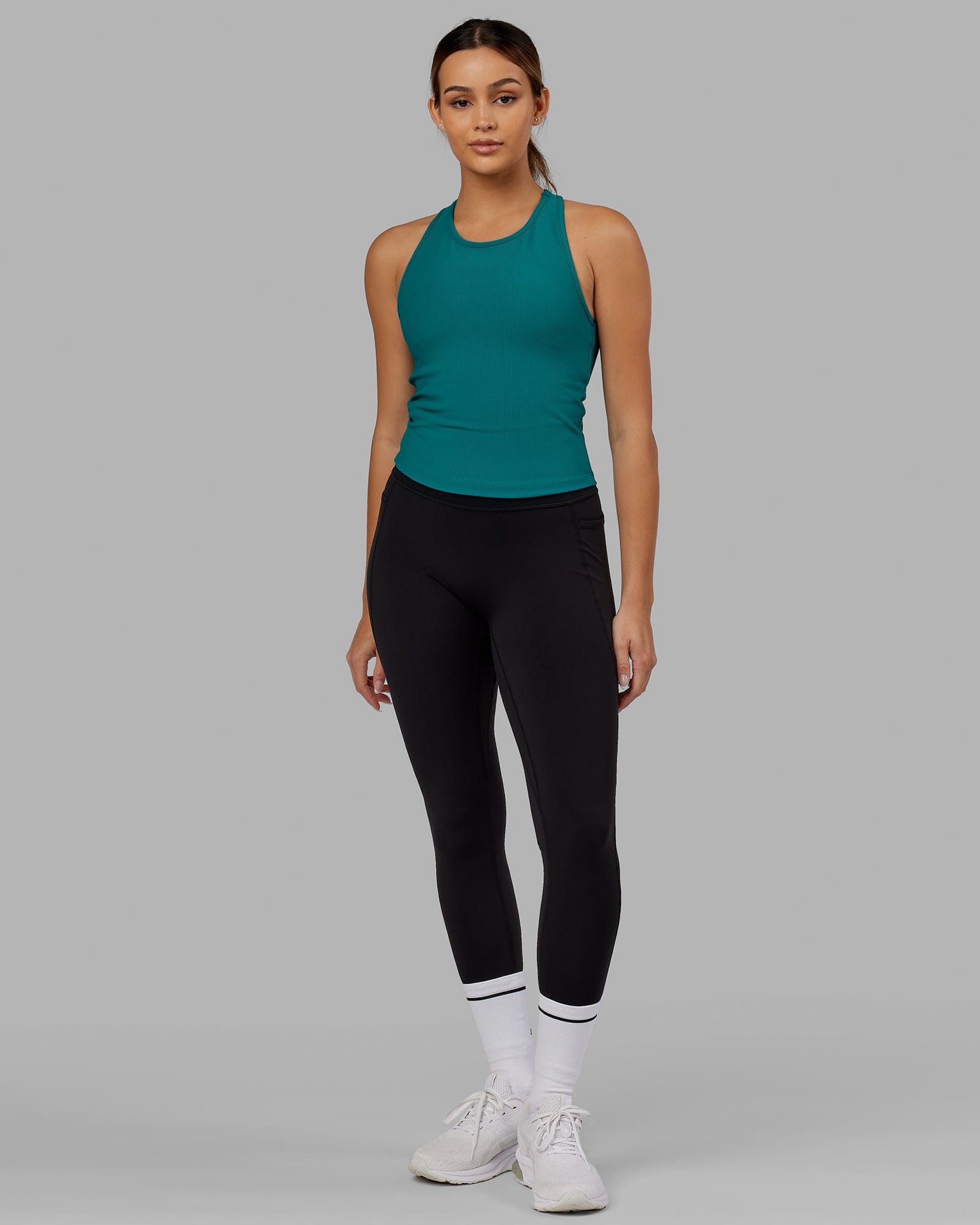 Model wearing Flow Ribbed Shelf Bra Performance Tank - Sea Green