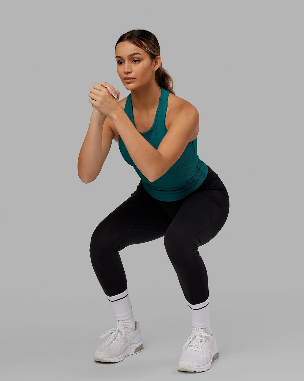 Model wearing Flow Ribbed Shelf Bra Performance Tank - Sea Green