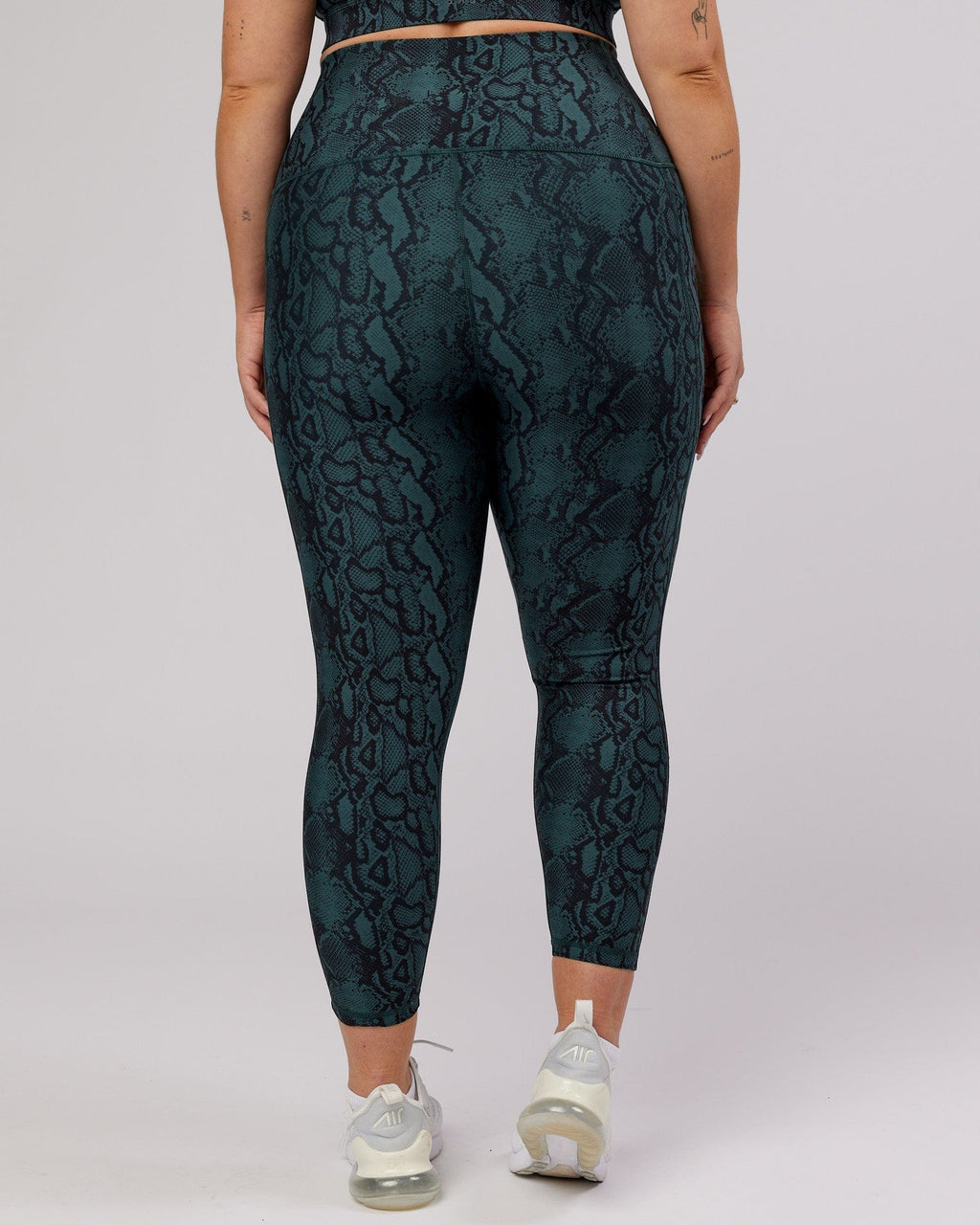 Model wearing Flux 7/8 Length Tight - Forest Snakeskin