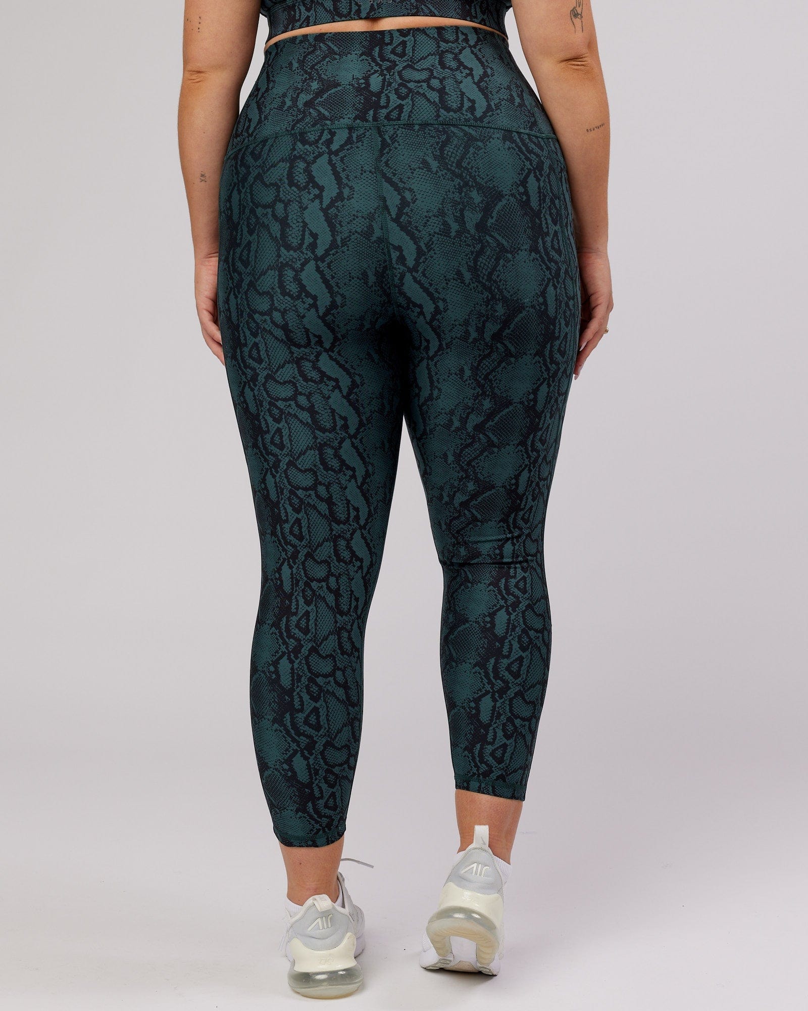 Model wearing Flux 7/8 Length Tight - Forest Snakeskin