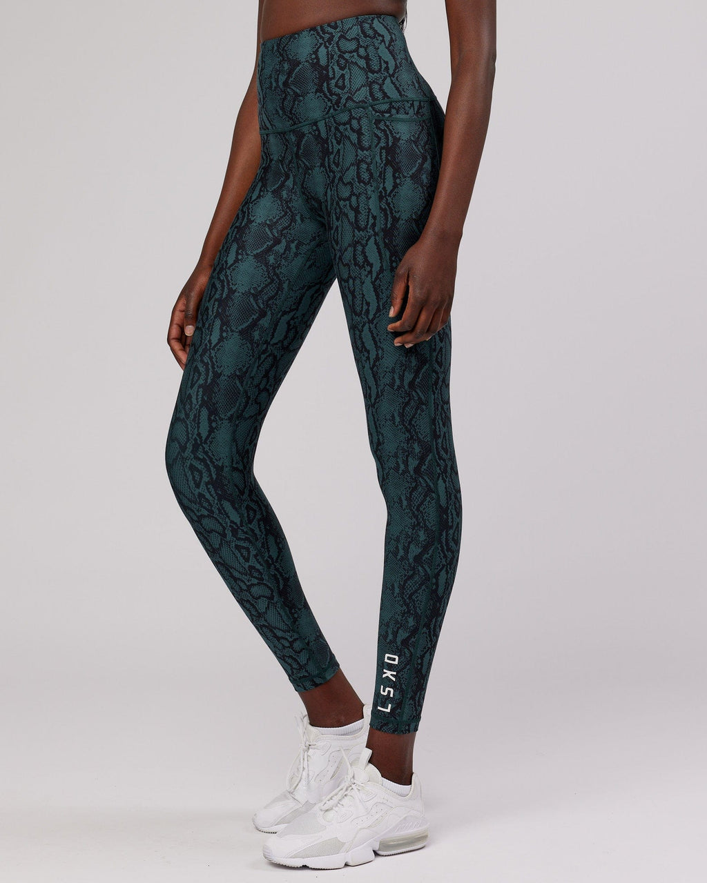 Model wearing Flux Full Length Tight - Forest Snakeskin