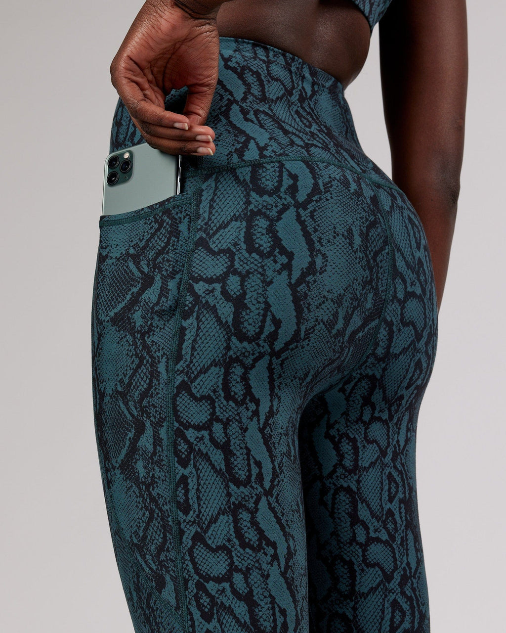 Model wearing Flux Full Length Tight - Forest Snakeskin