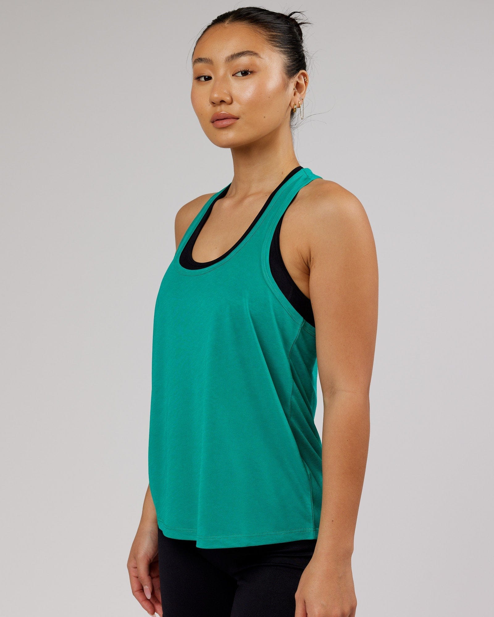 Model wearing Free Throw Tank - Hyper Teal