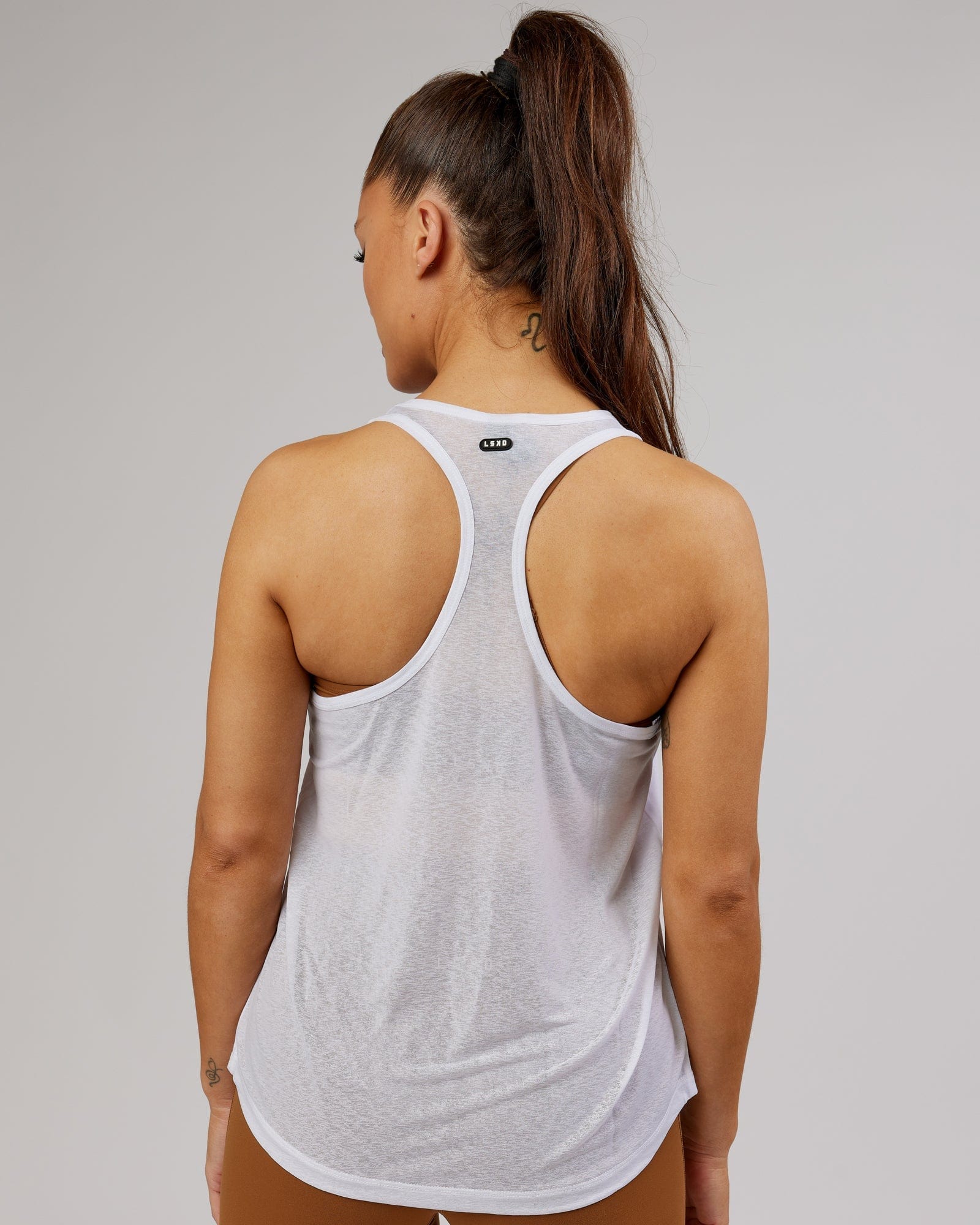 Model wearing Free Throw Tank - White