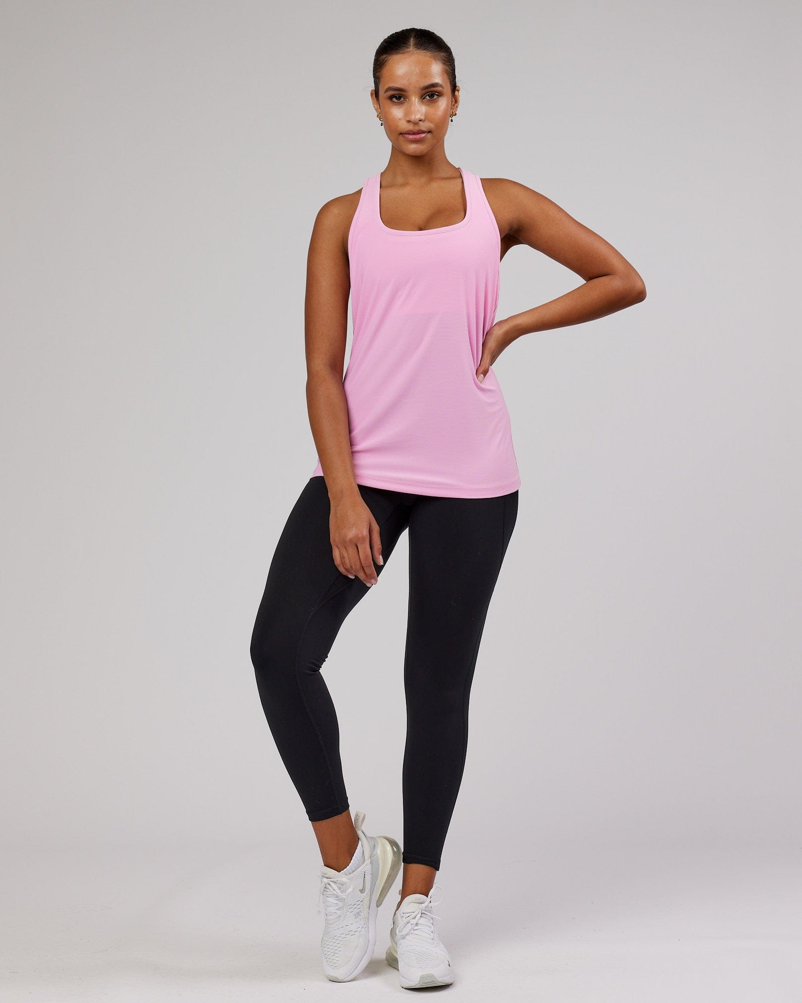 Model wearing Freedom Performance Tank - Pink Frosting