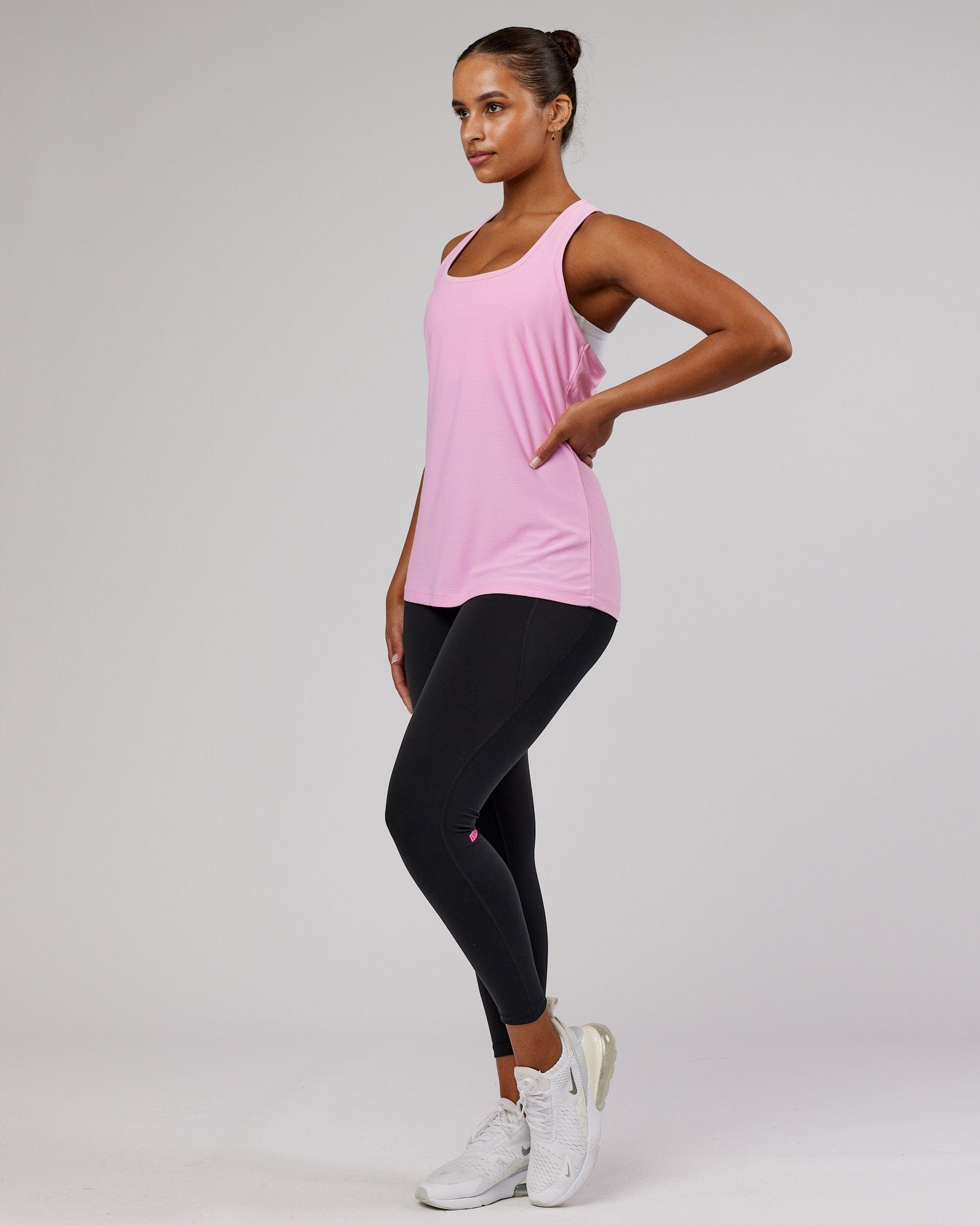 Model wearing Freedom Performance Tank - Pink Frosting
