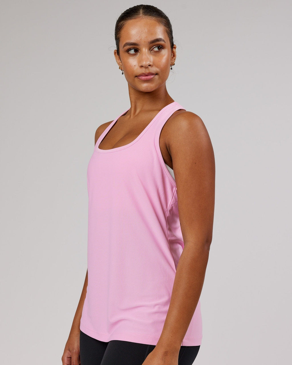 Model wearing Freedom Performance Tank - Pink Frosting