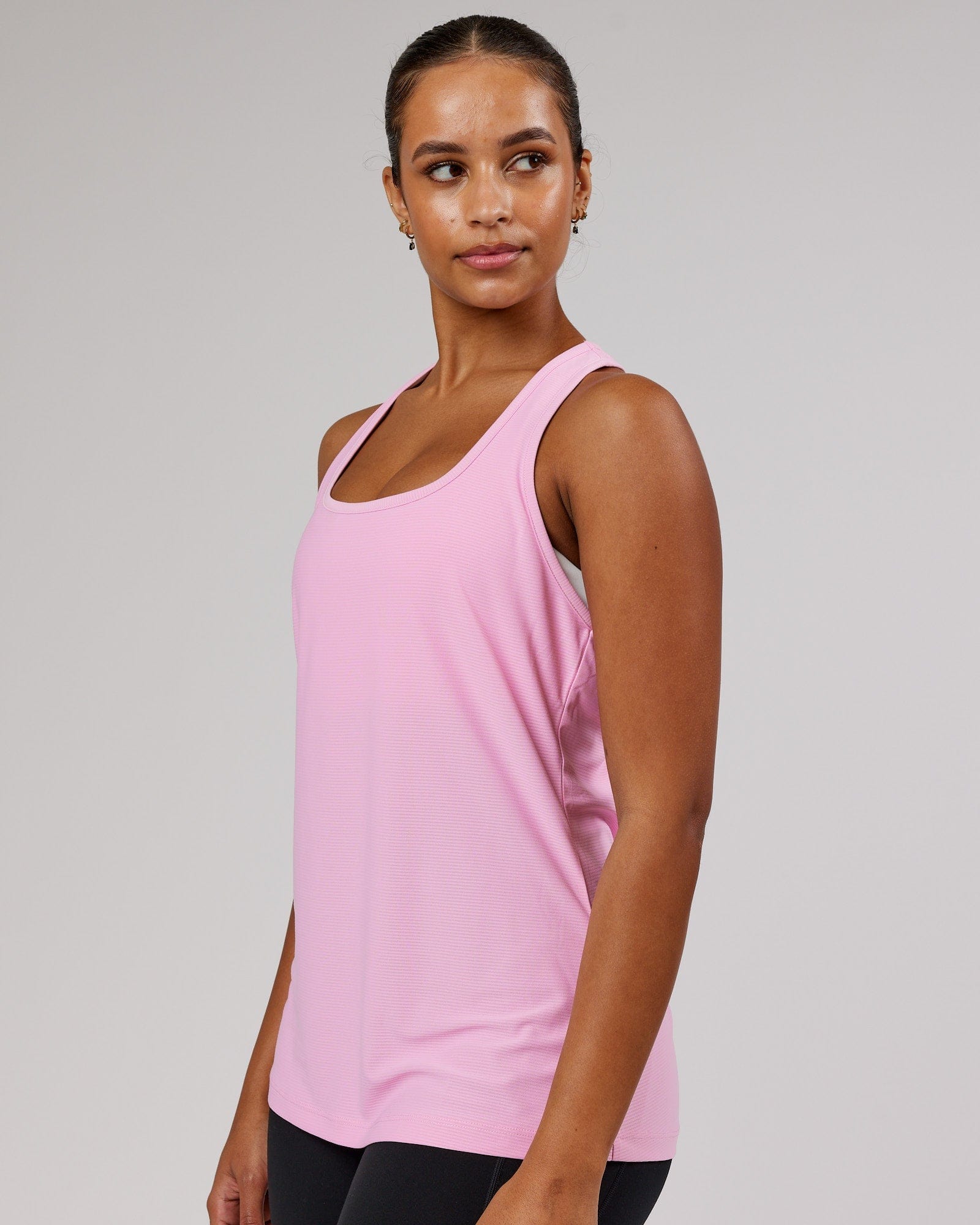 Model wearing Freedom Performance Tank - Pink Frosting