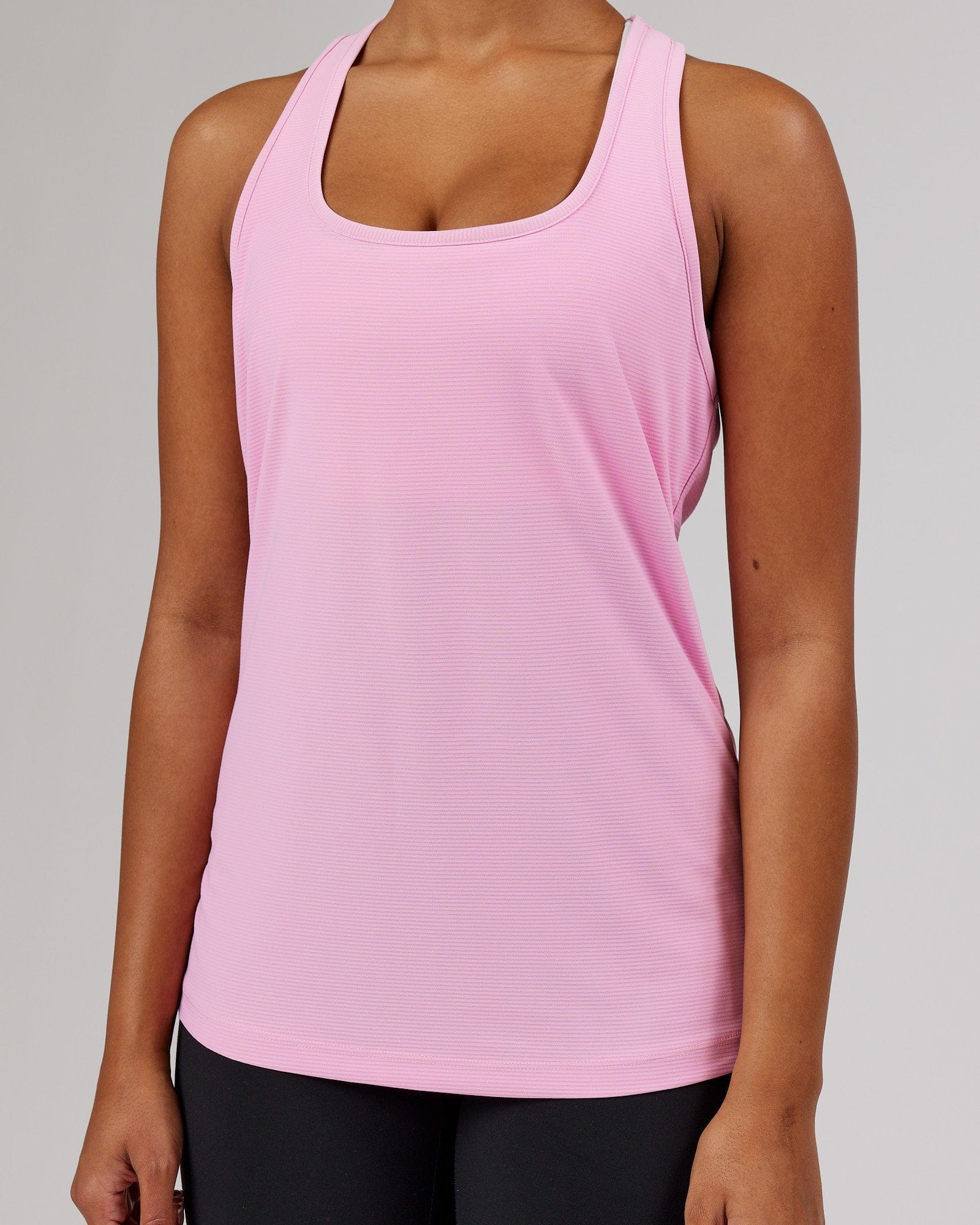 Model wearing Freedom Performance Tank - Pink Frosting