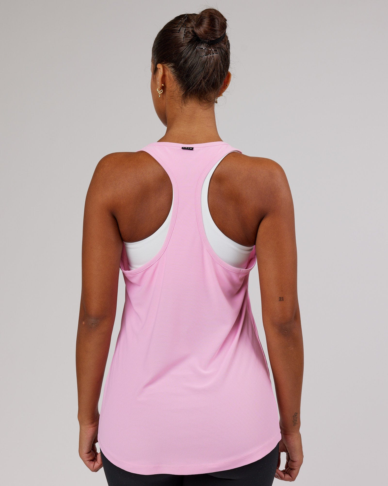Model wearing Freedom Performance Tank - Pink Frosting