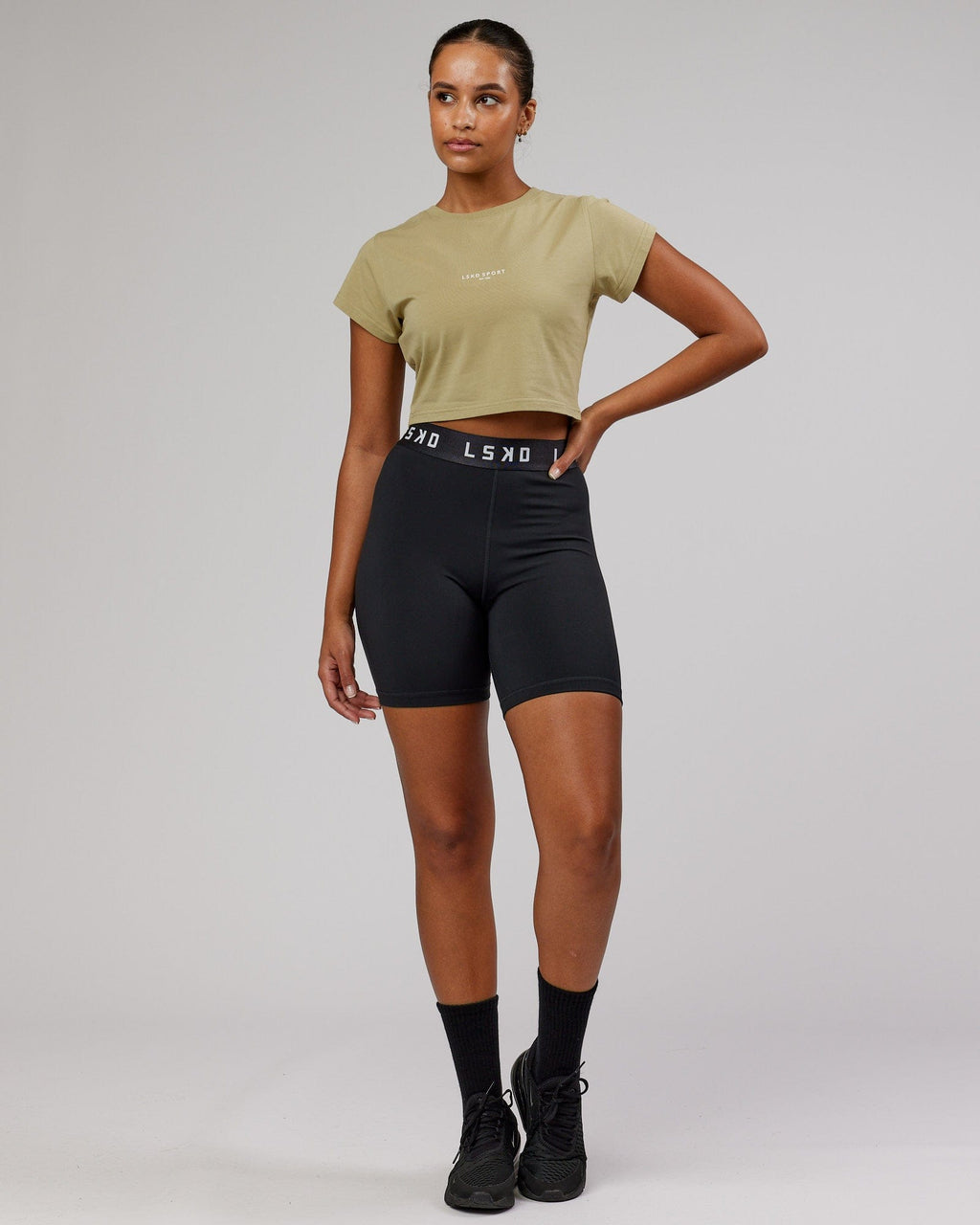 Model wearing Front Runner Baby Tee - Reed