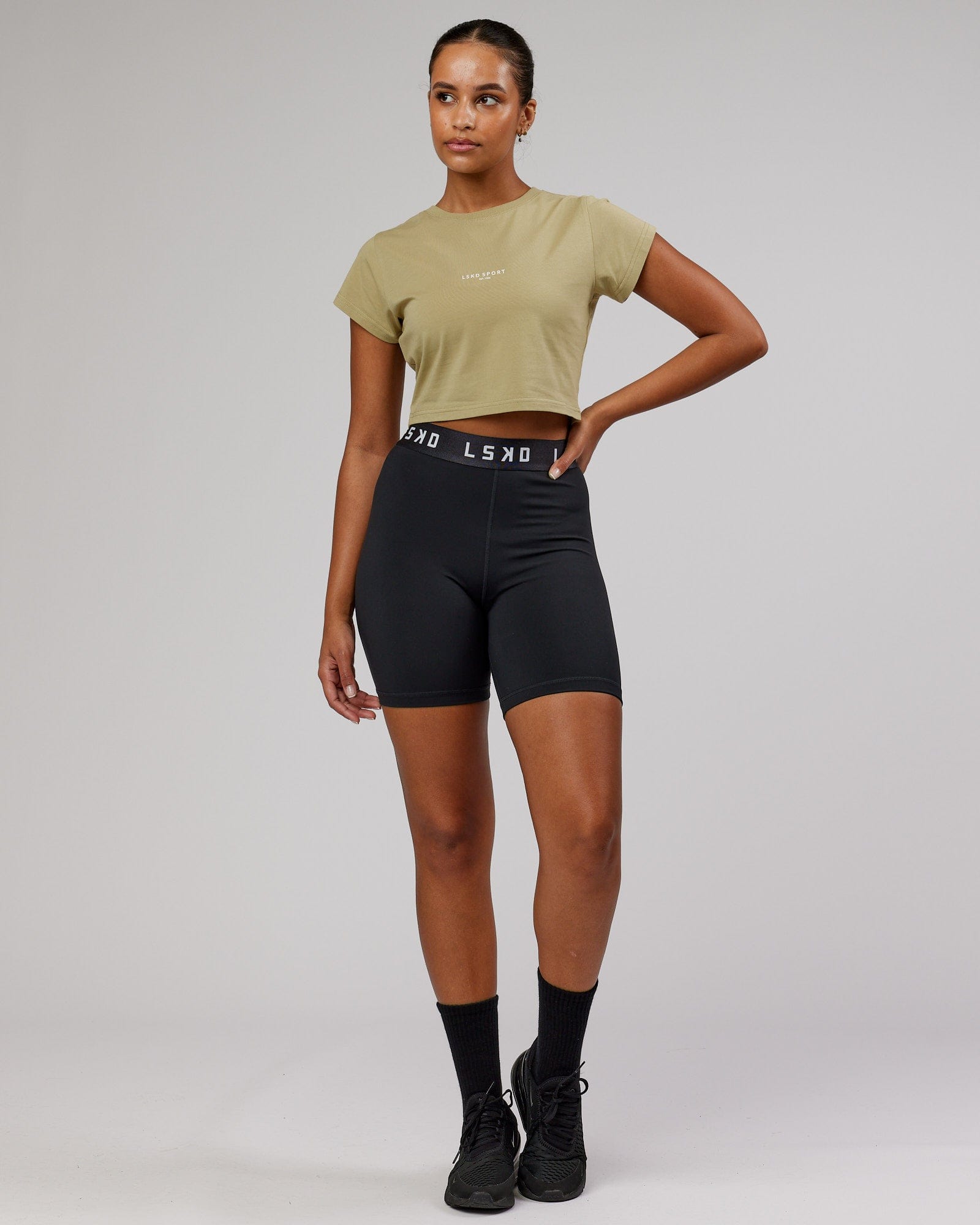 Model wearing Front Runner Baby Tee - Reed