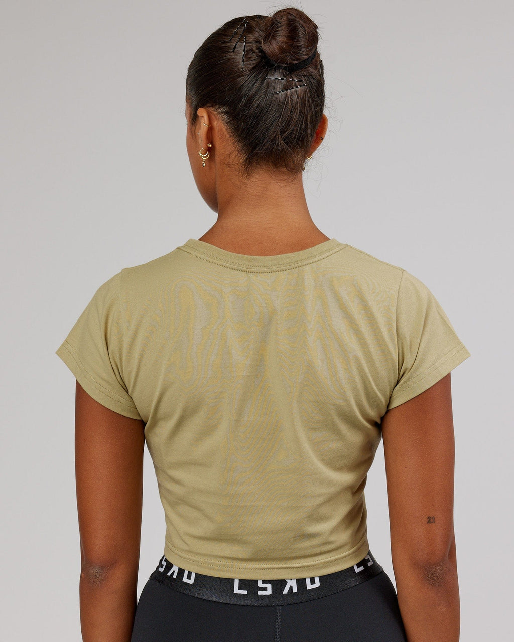 Model wearing Front Runner Baby Tee - Reed