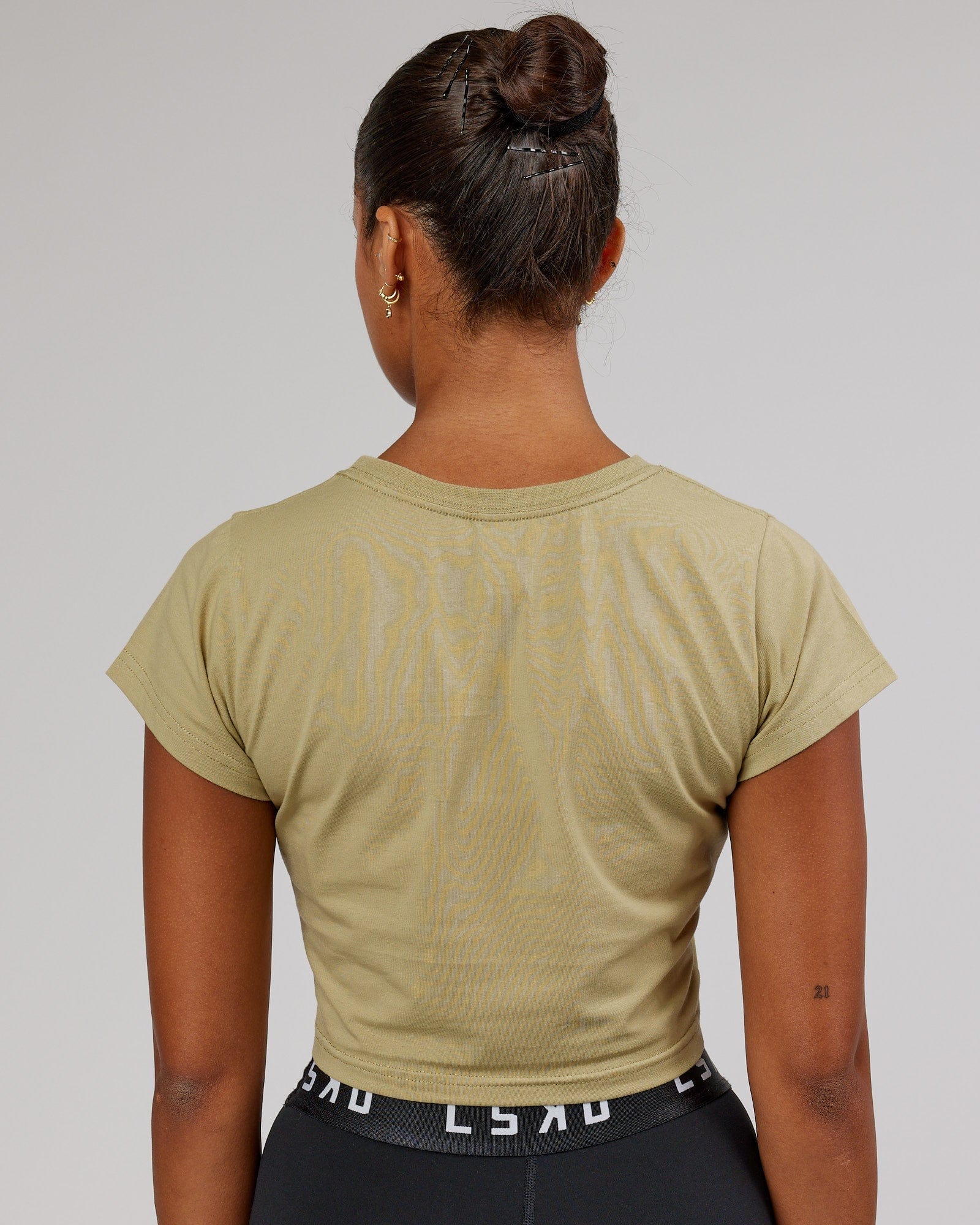 Model wearing Front Runner Baby Tee - Reed