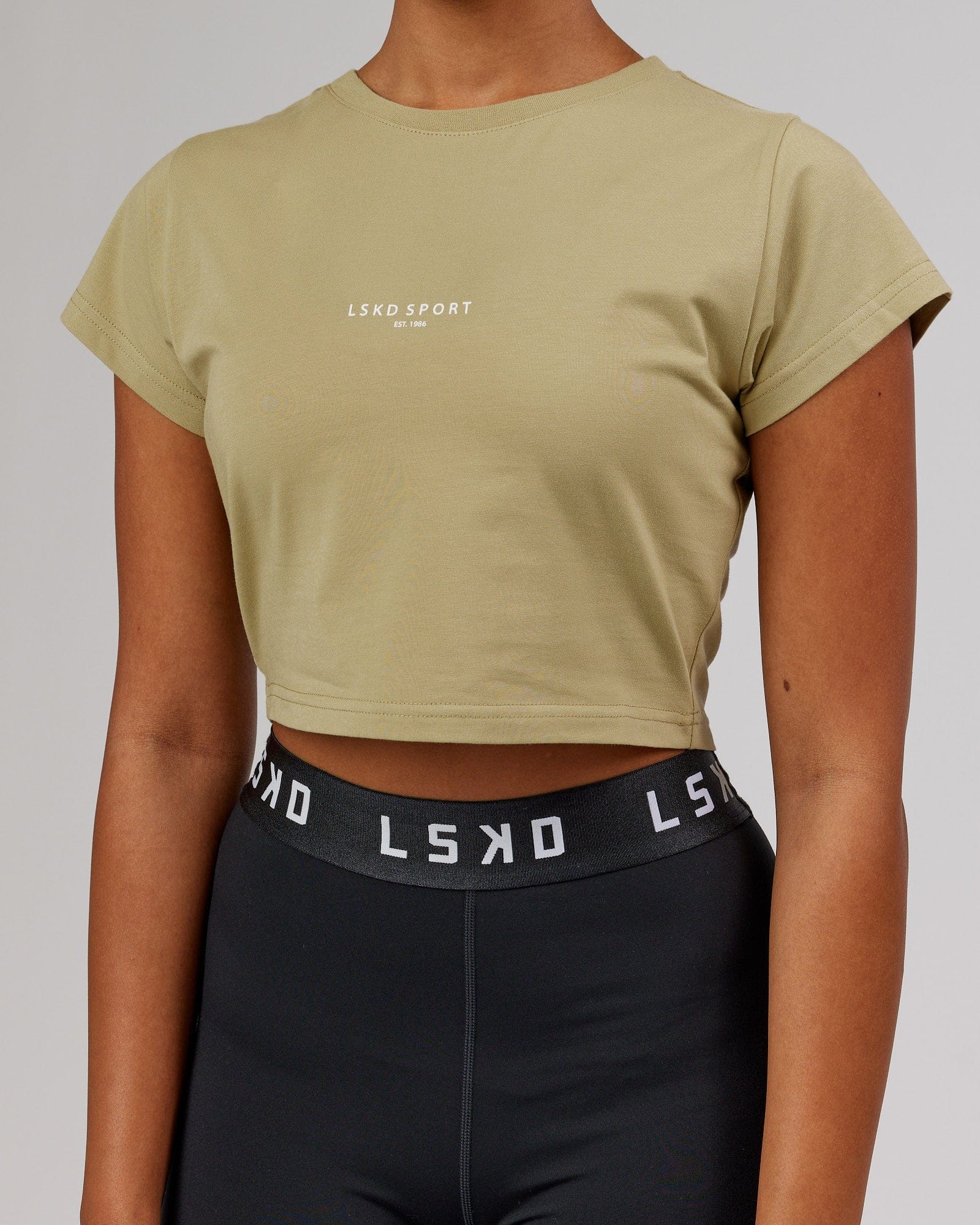 Model wearing Front Runner Baby Tee - Reed