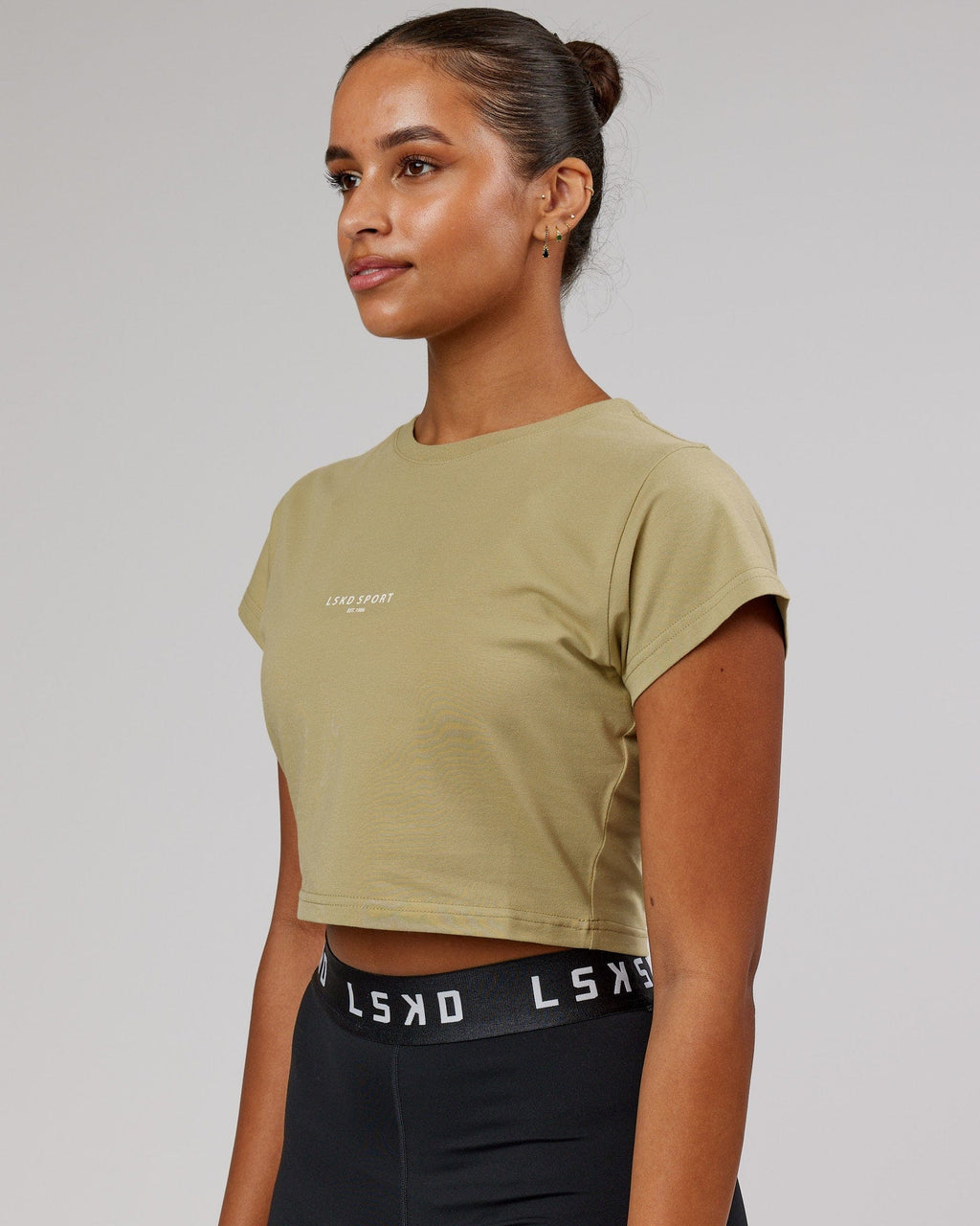 Model wearing Front Runner Baby Tee - Reed