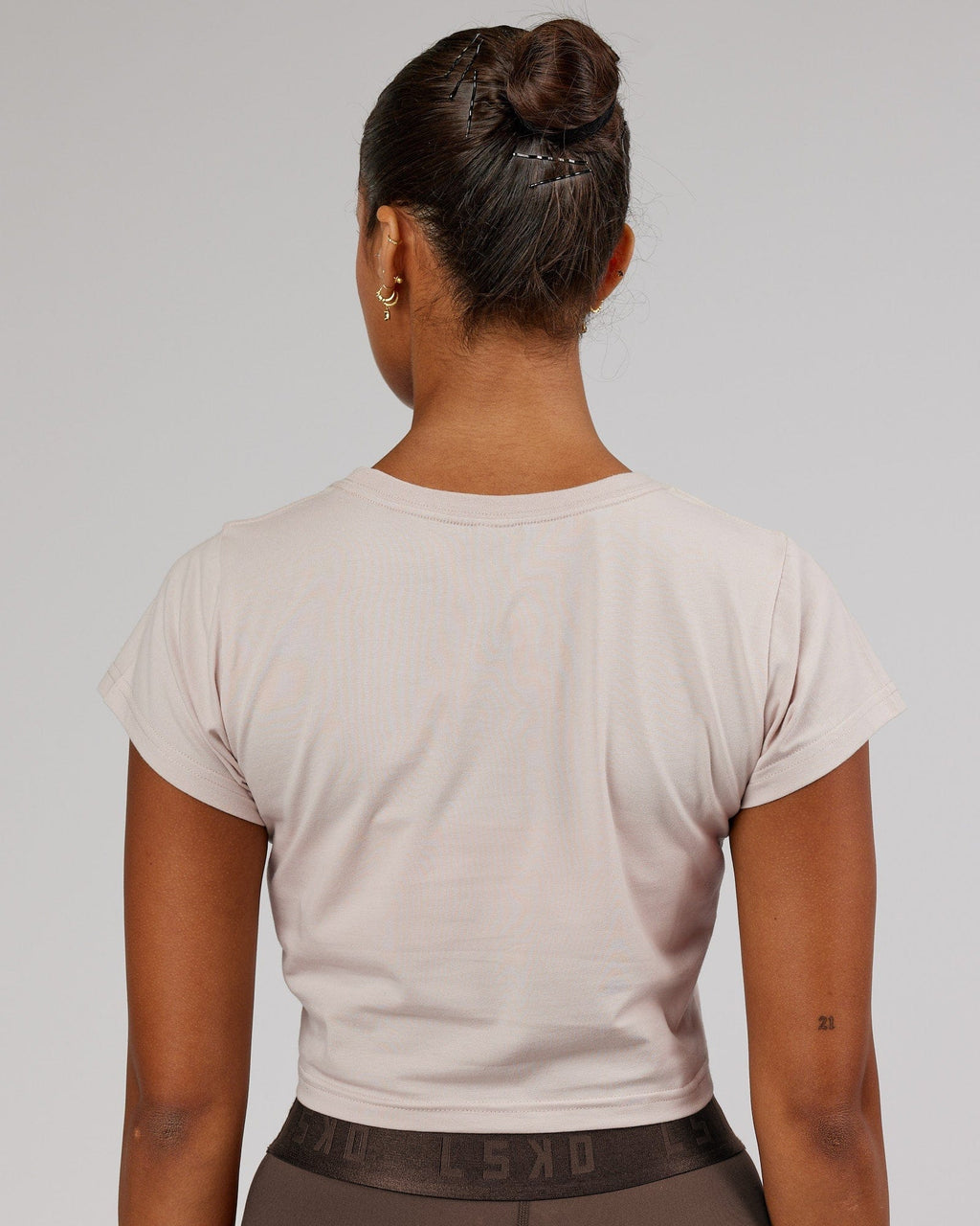 Model wearing Front Runner Baby Tee - Silver Grey