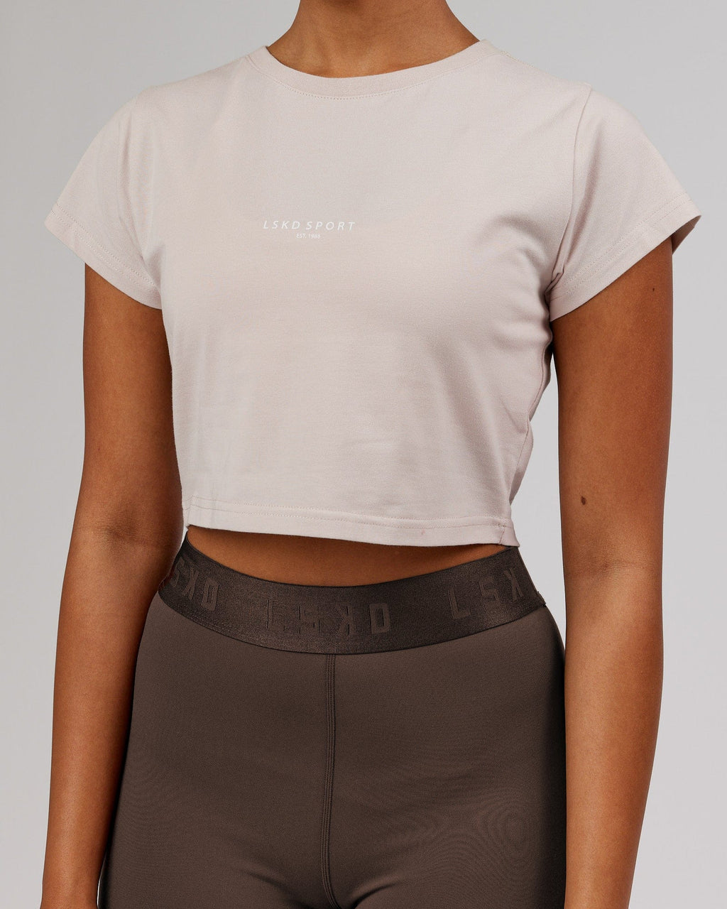 Model wearing Front Runner Baby Tee - Silver Grey