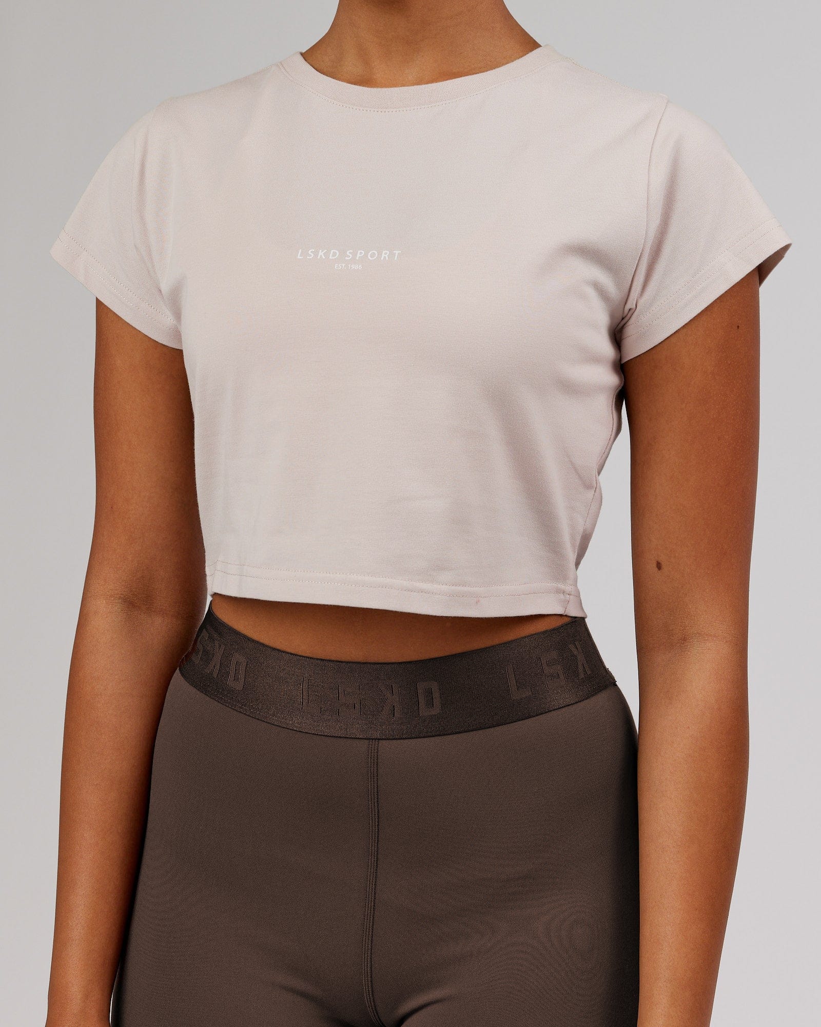 Model wearing Front Runner Baby Tee - Silver Grey