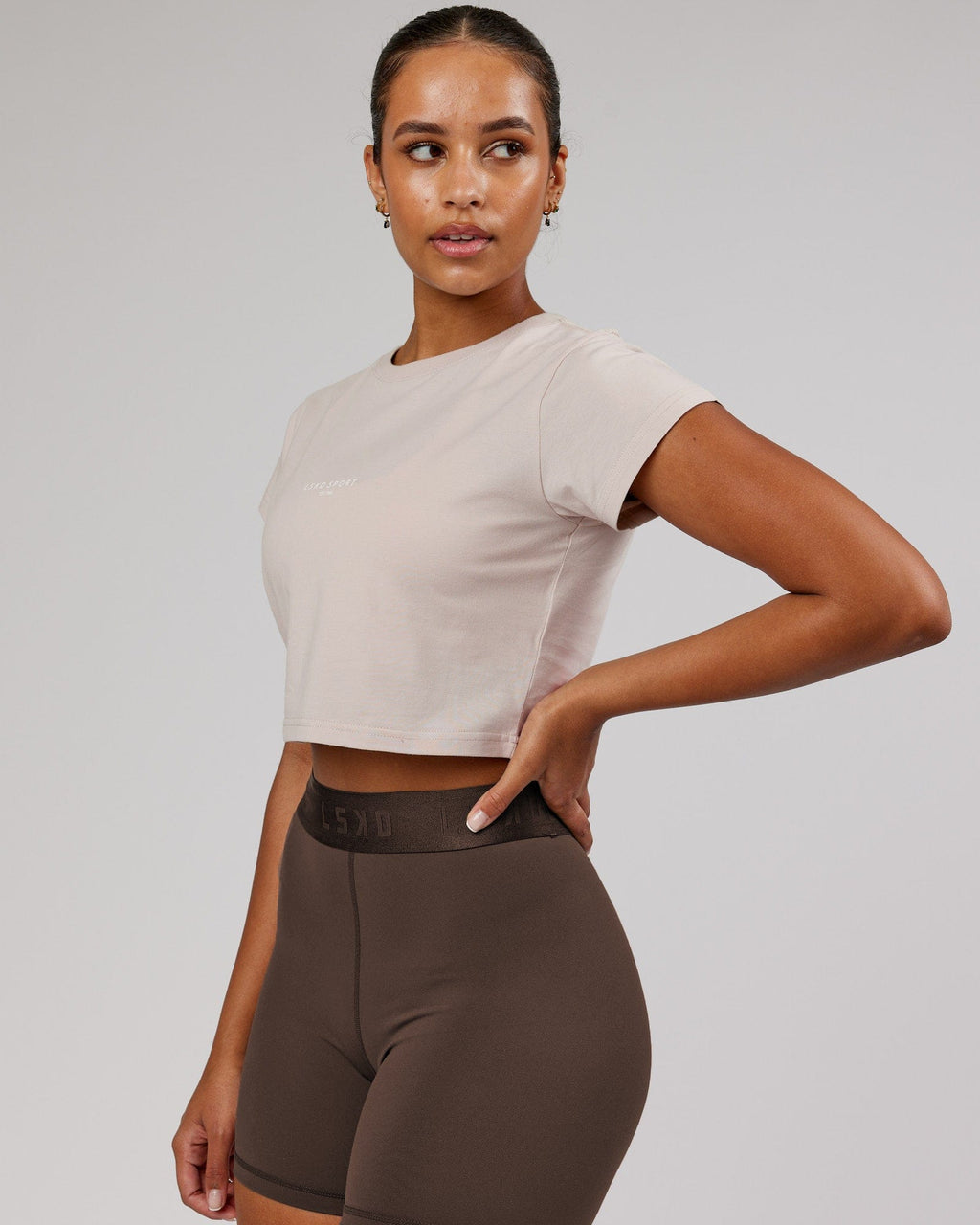 Model wearing Front Runner Baby Tee - Silver Grey