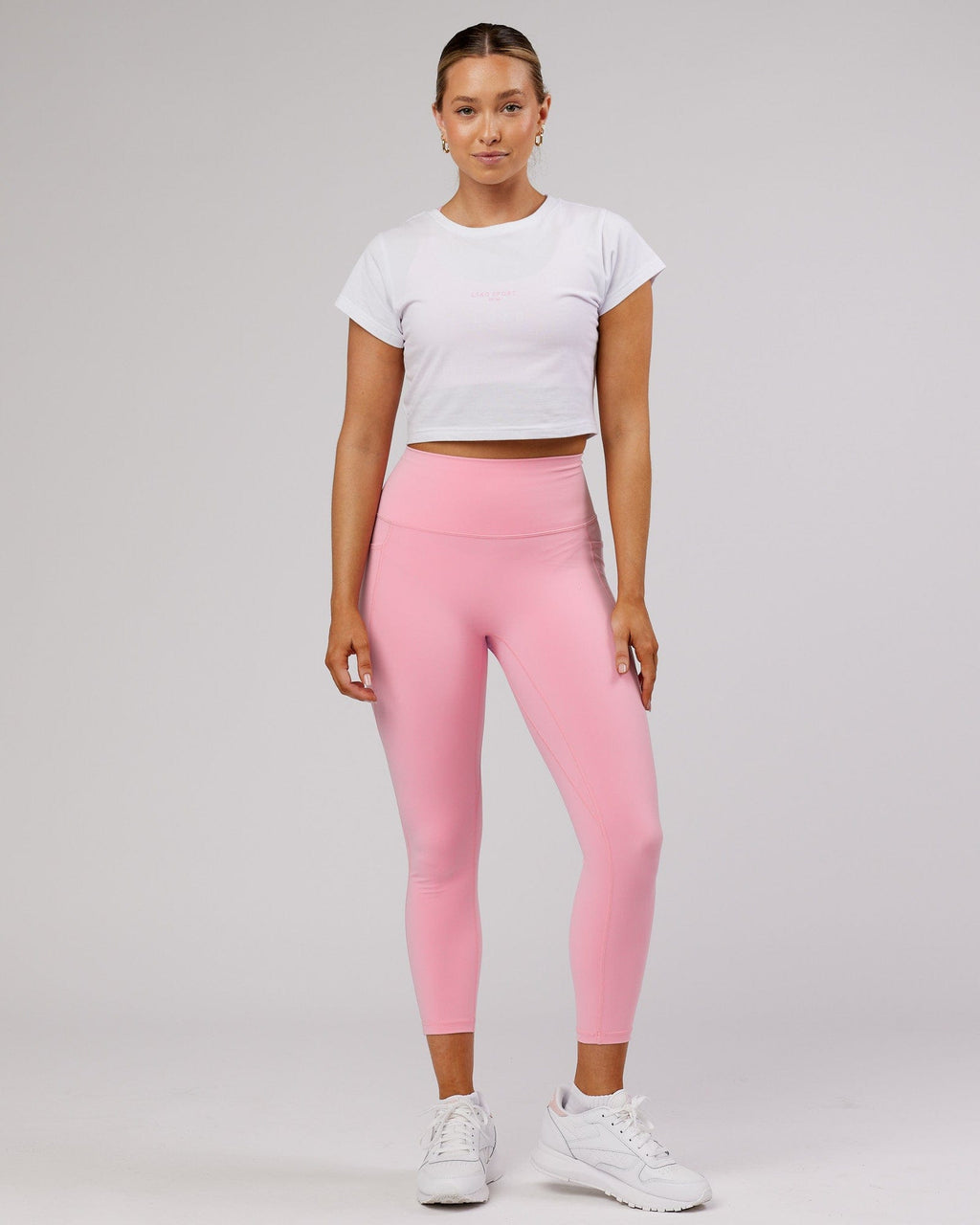 Model wearing Front Runner Baby Tee - White-Pink Frosting