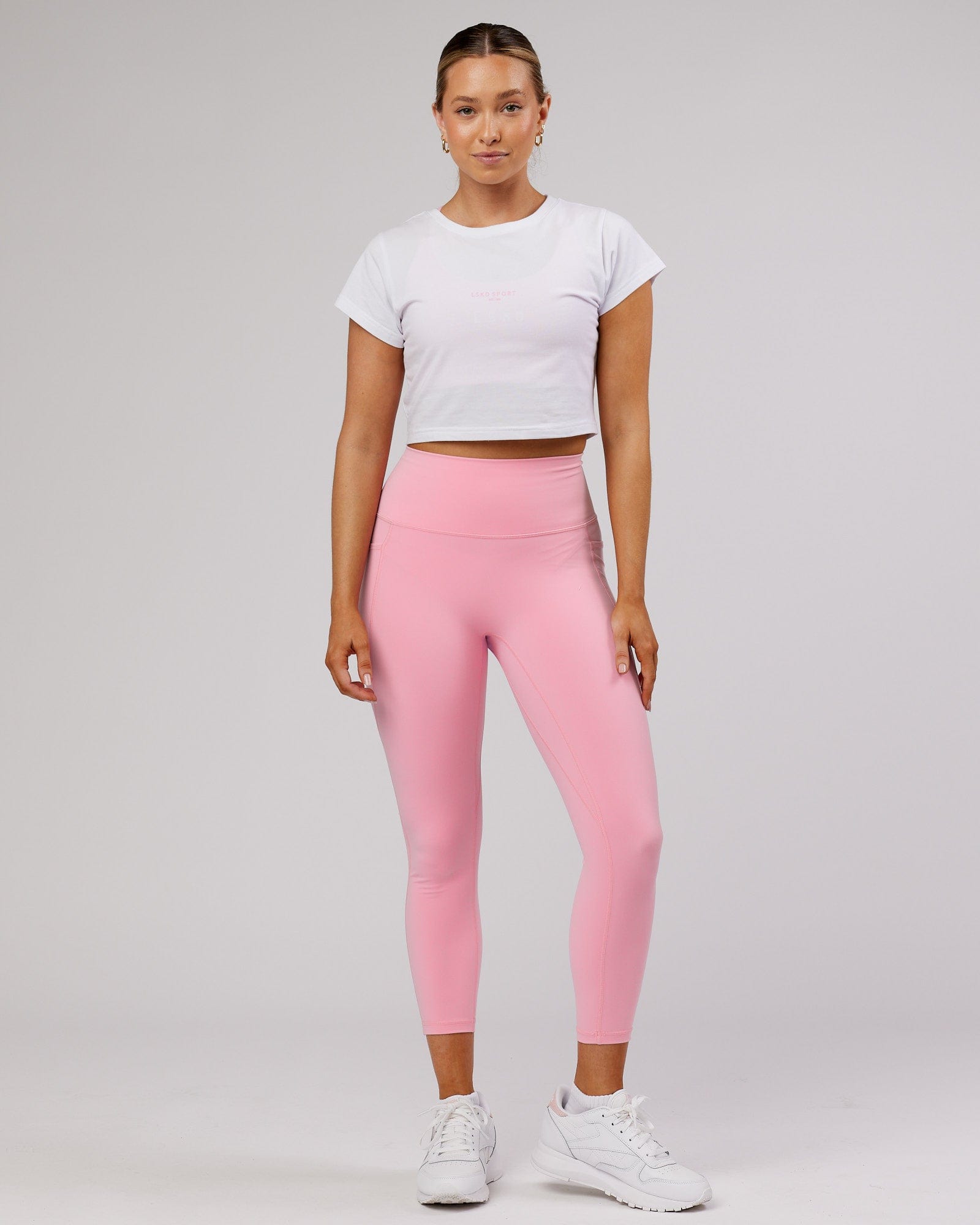 Model wearing Front Runner Baby Tee - White-Pink Frosting