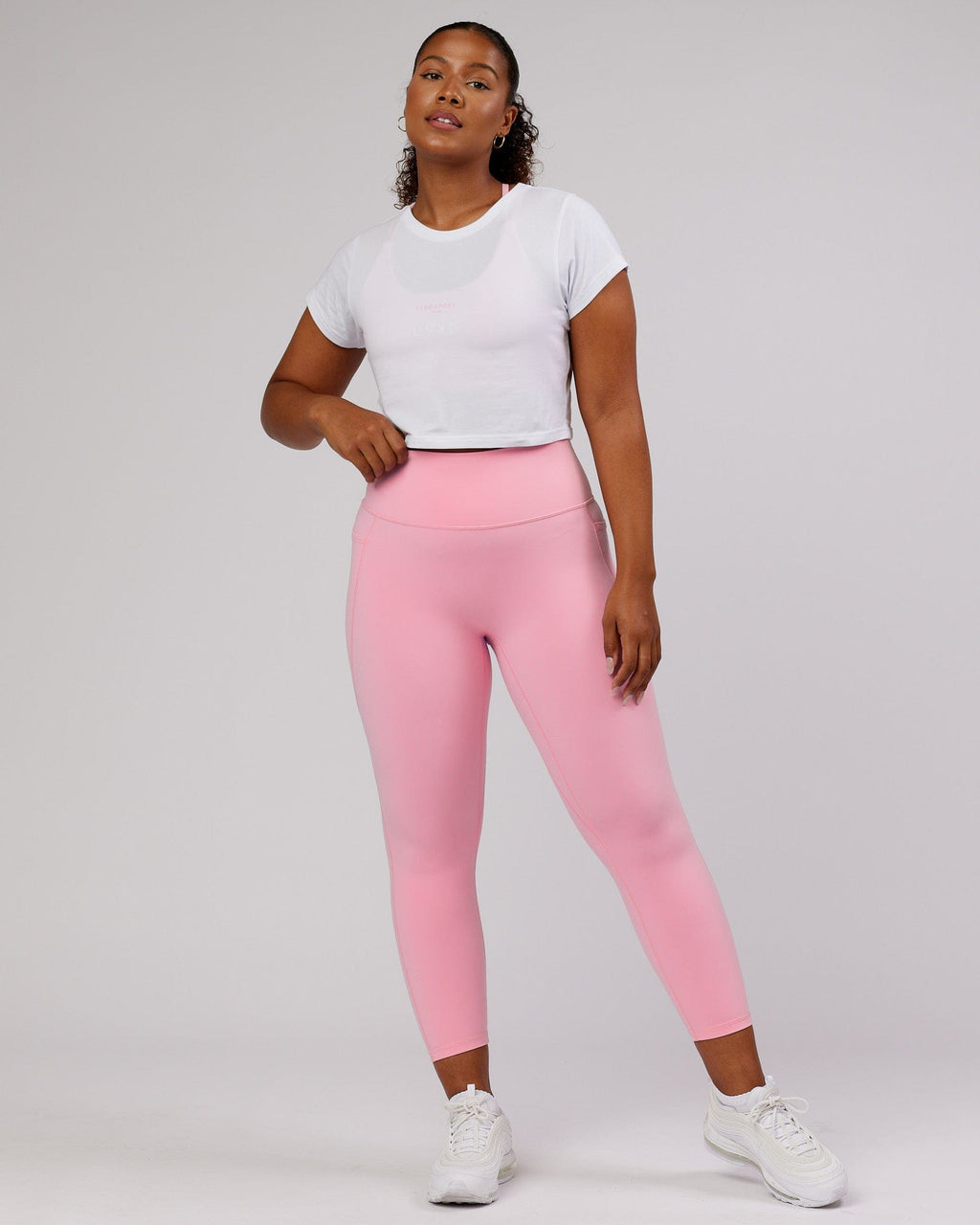 Model wearing Front Runner Baby Tee - White-Pink Frosting