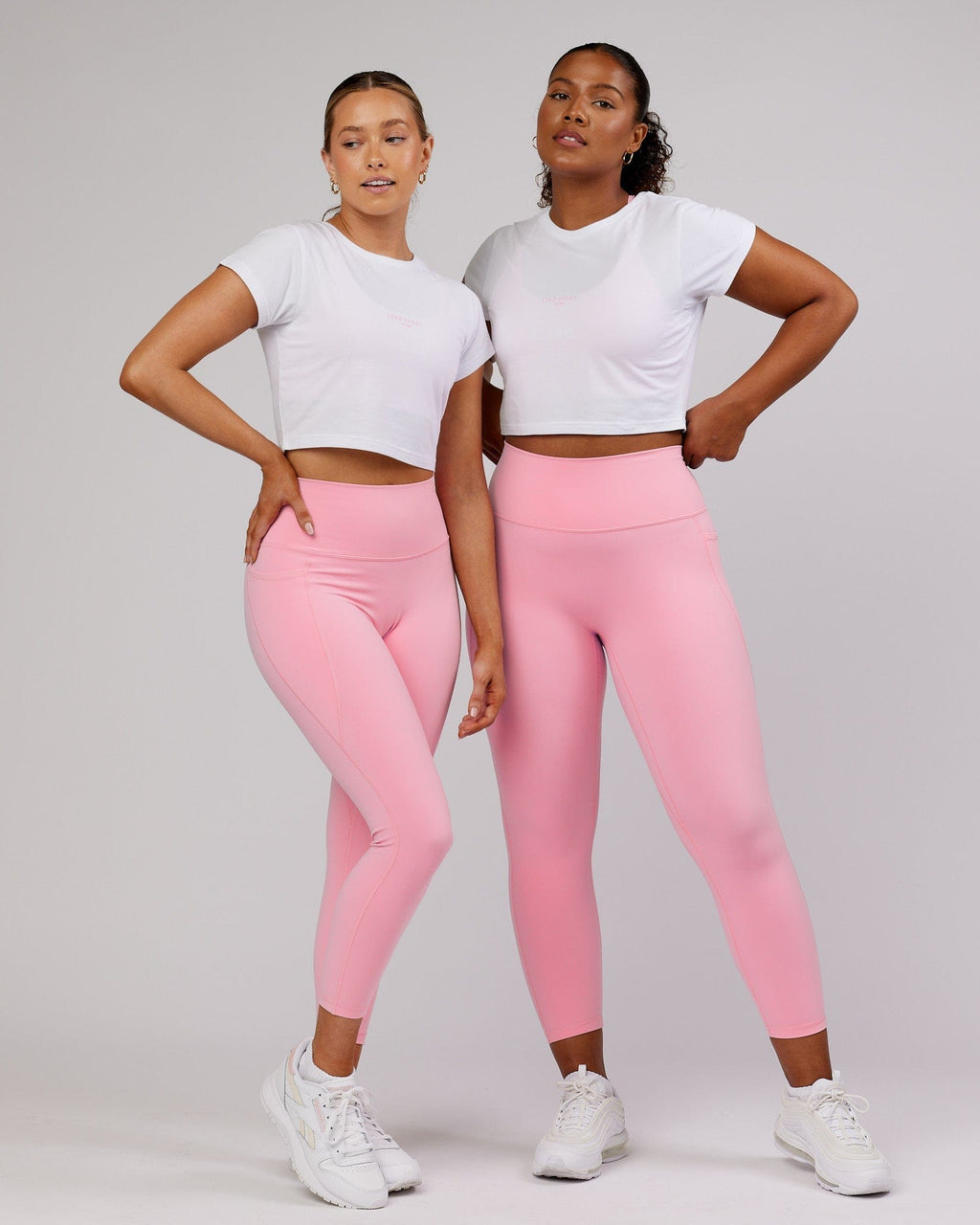 Model wearing Front Runner Baby Tee - White-Pink Frosting