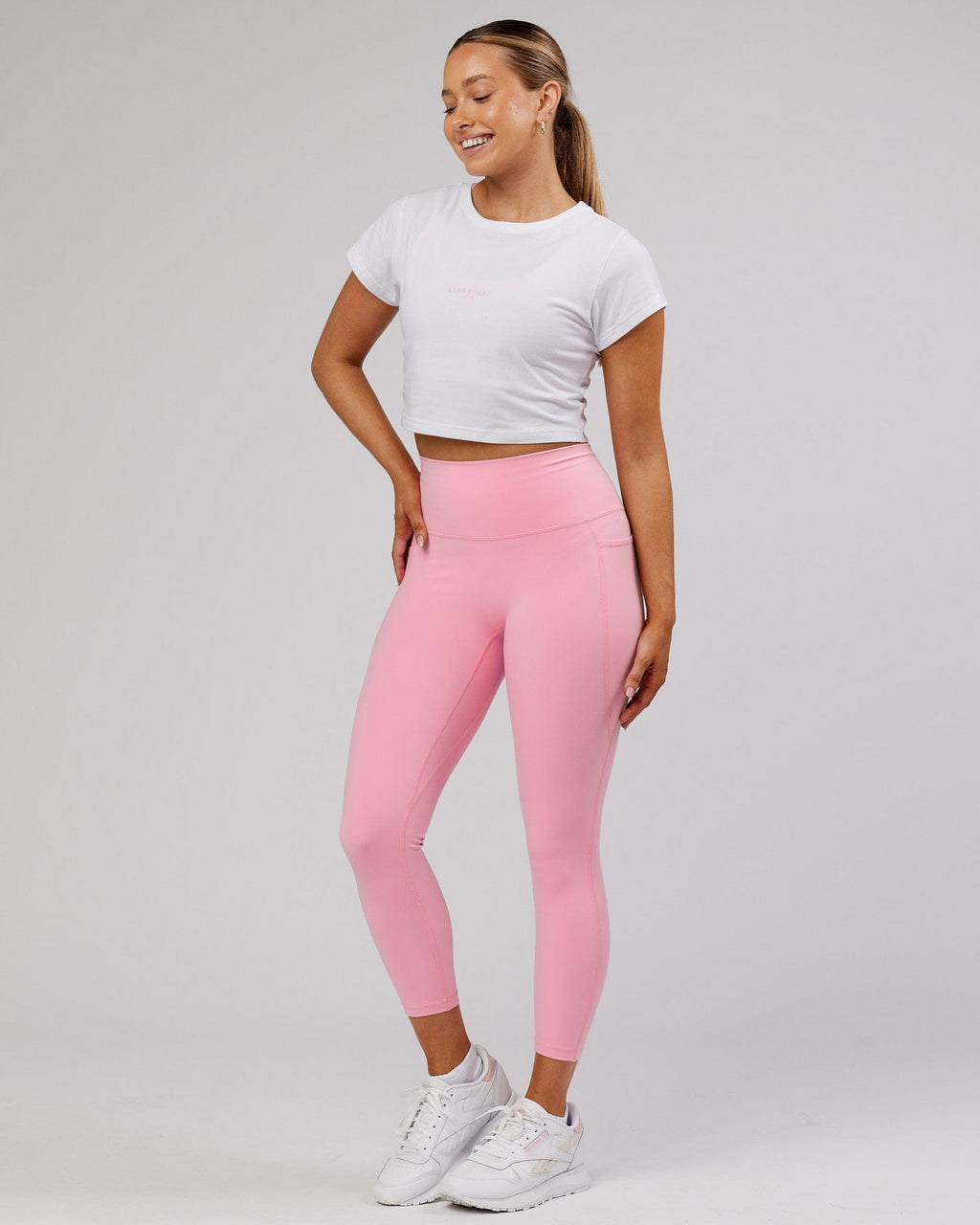 Model wearing Front Runner Baby Tee - White-Pink Frosting