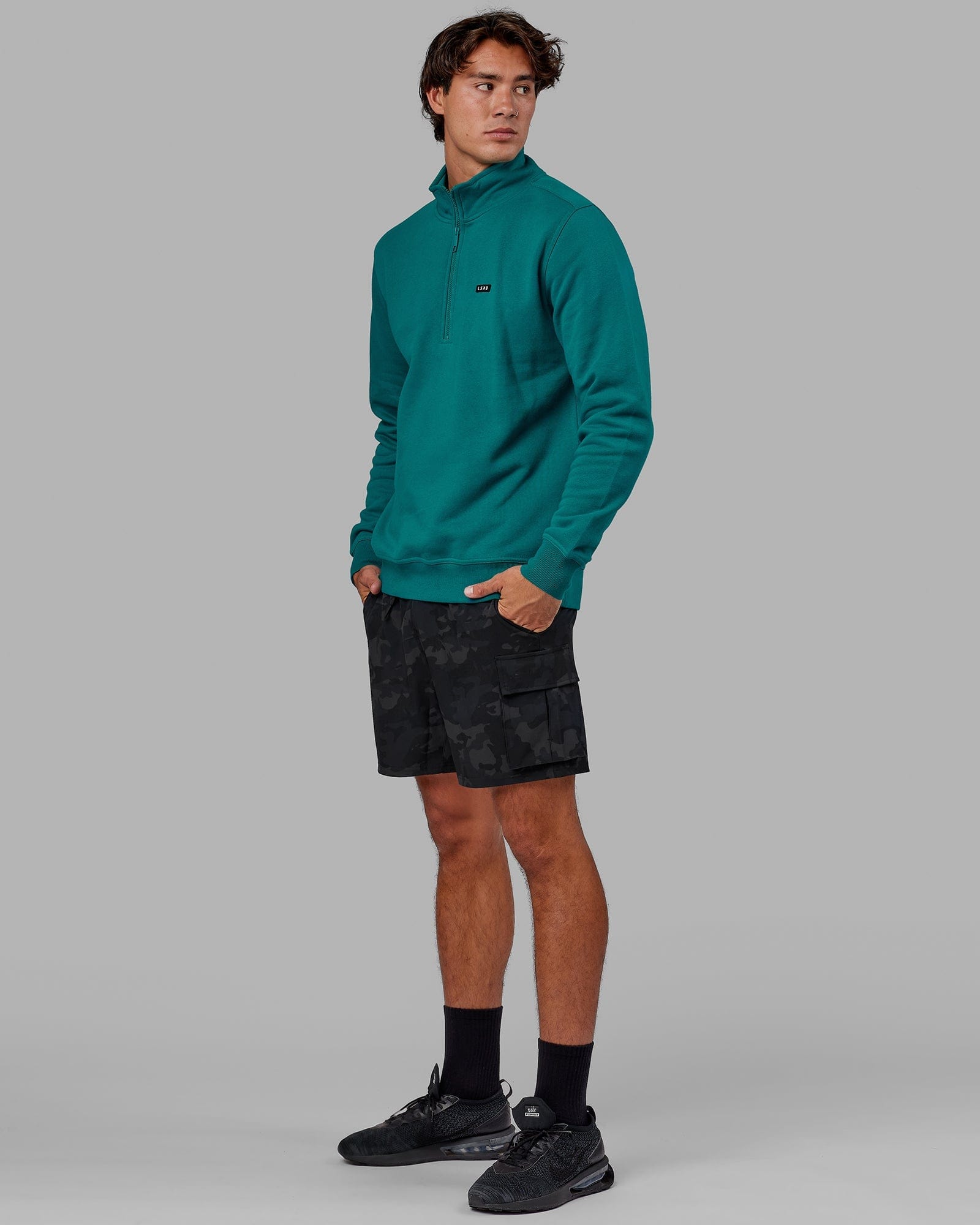 Model wearing Fundamental 1/4 Zip Sweater - Deep Lake