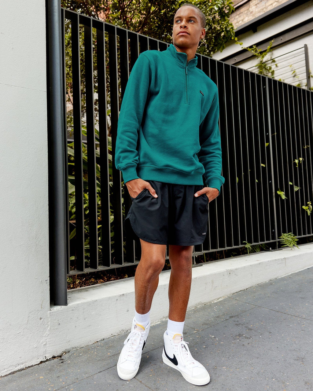 Model wearing Fundamental 1/4 Zip Sweater - Deep Lake