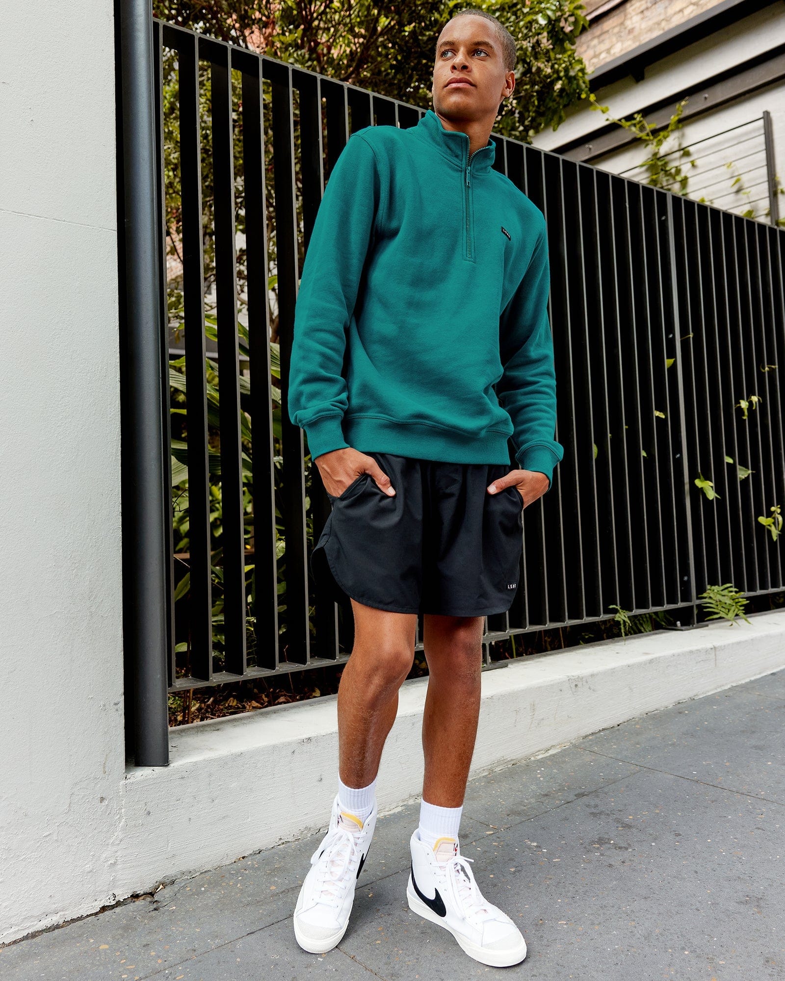 Model wearing Fundamental 1/4 Zip Sweater - Deep Lake