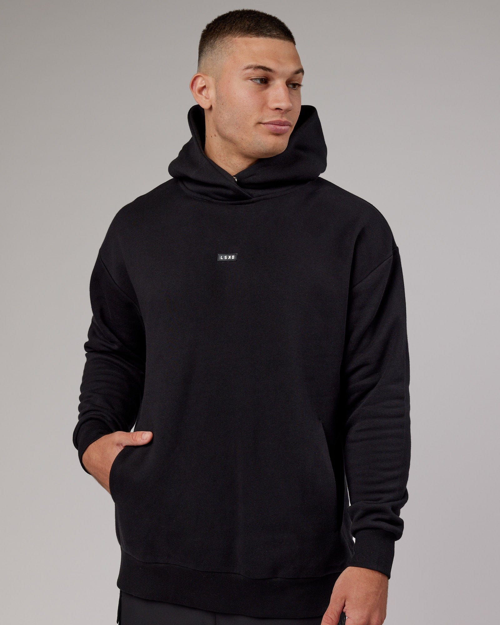 Model wearing Fundamental Hoodie Oversize - Black