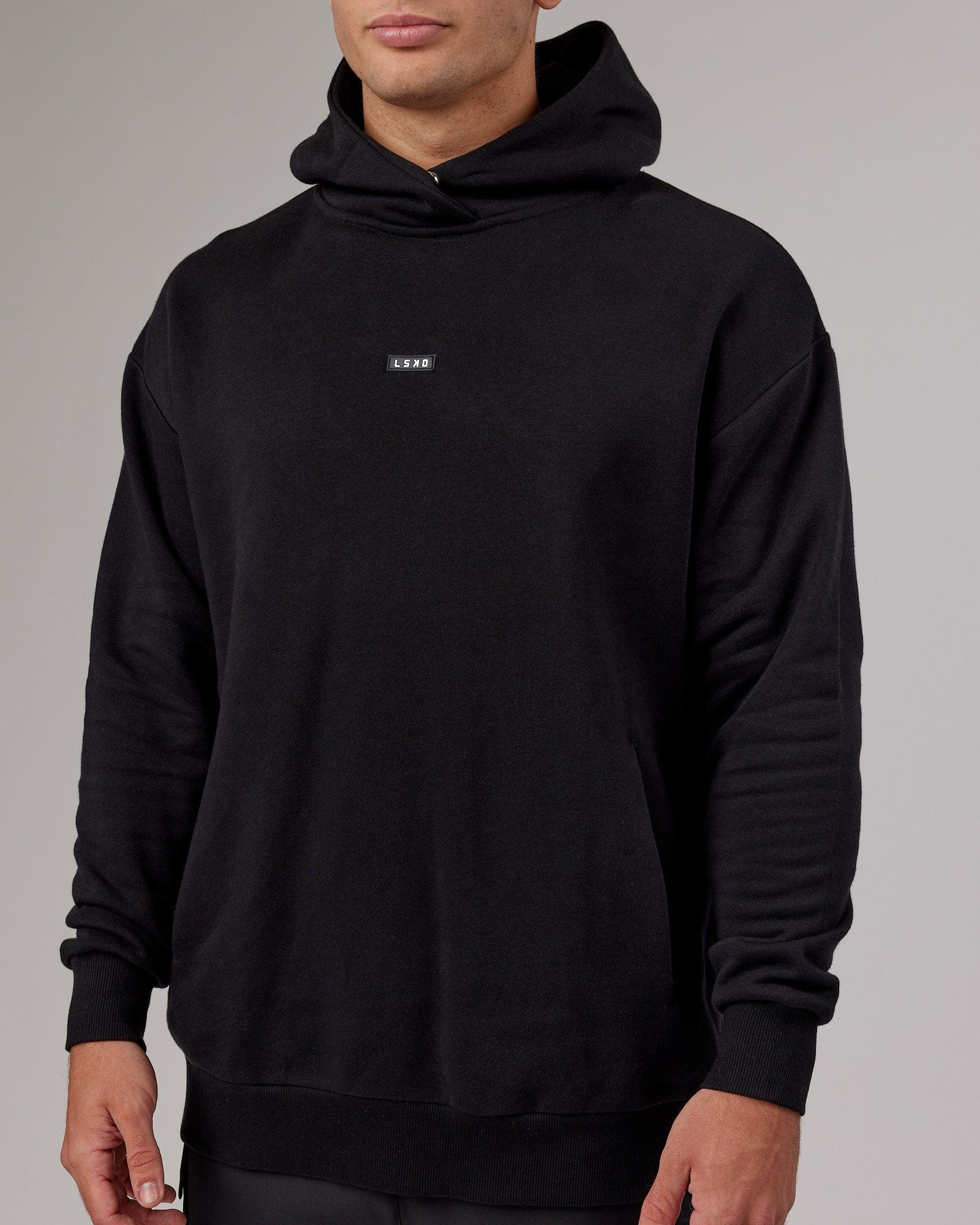 Model wearing Fundamental Hoodie Oversize - Black