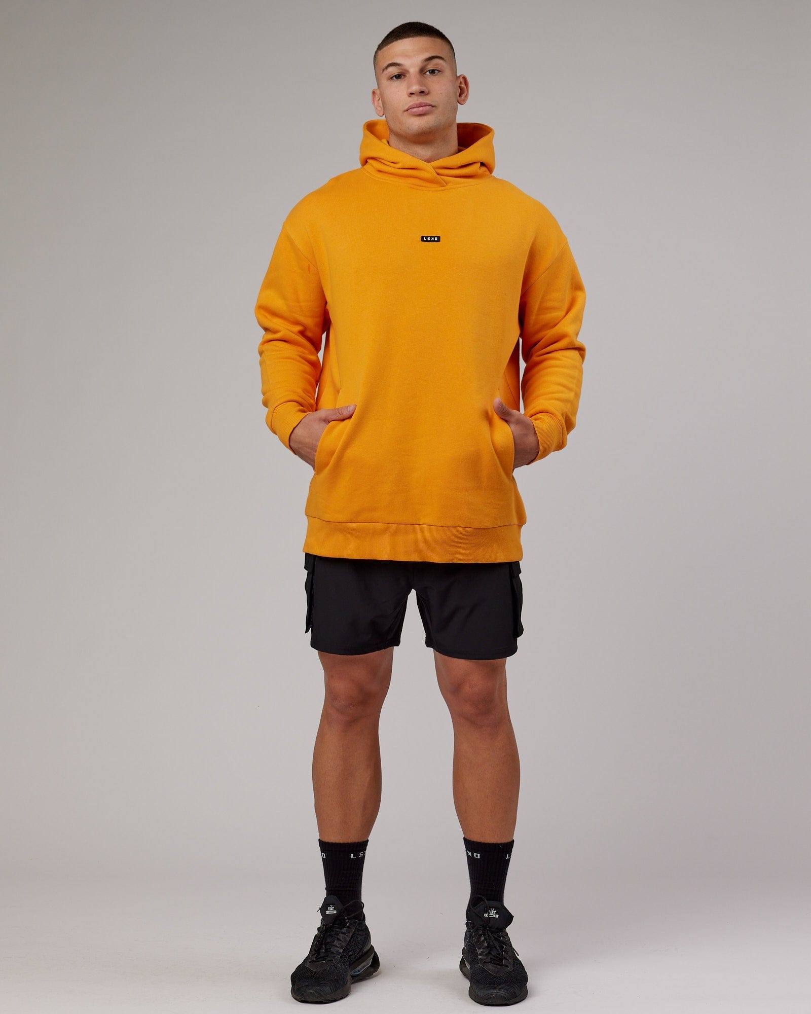 Model wearing Fundamental Hoodie Oversize - Butterscotch