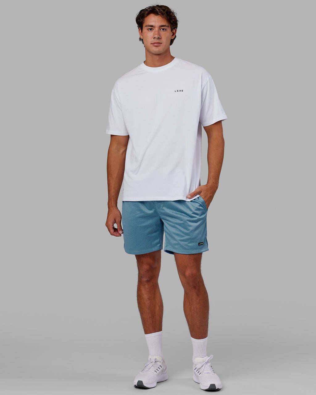 Model wearing Fundamental Mesh Short - Azure Blue