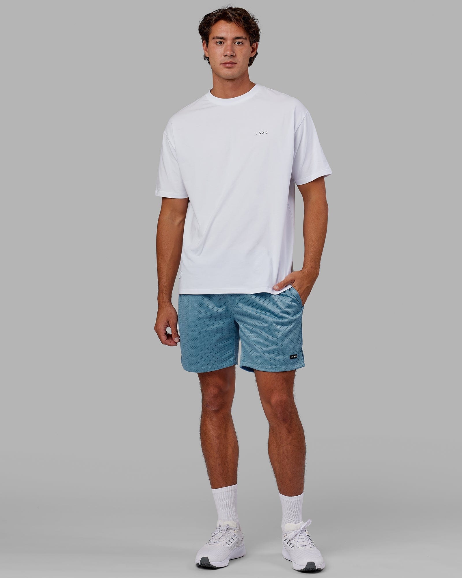 Model wearing Fundamental Mesh Short - Azure Blue