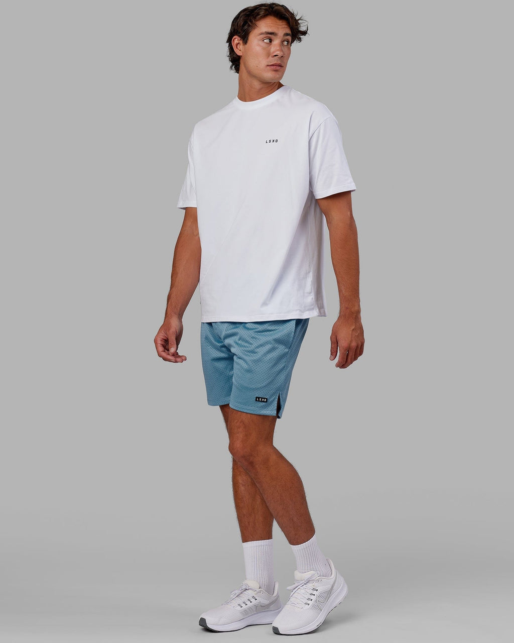 Model wearing Fundamental Mesh Short - Azure Blue