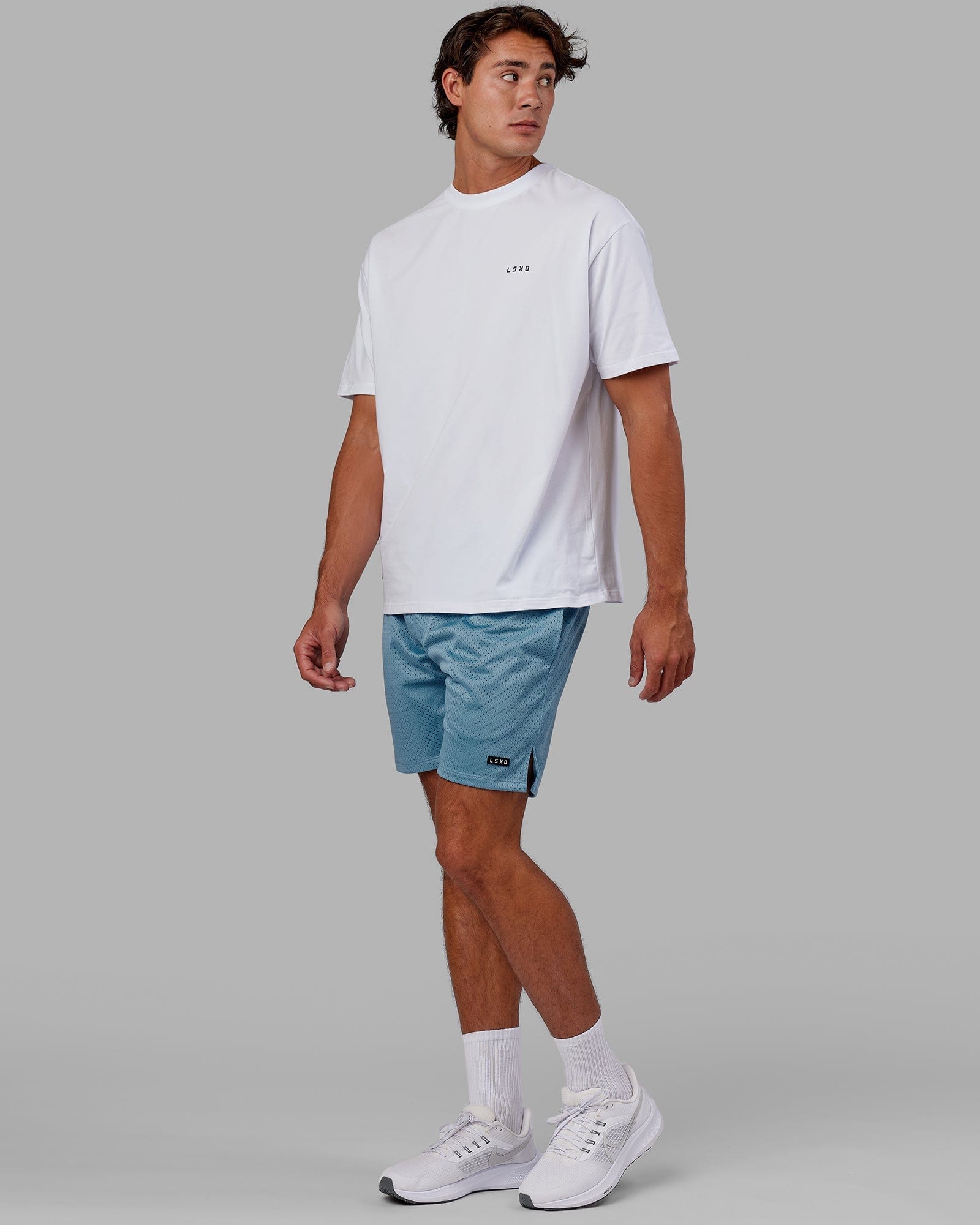 Model wearing Fundamental Mesh Short - Azure Blue