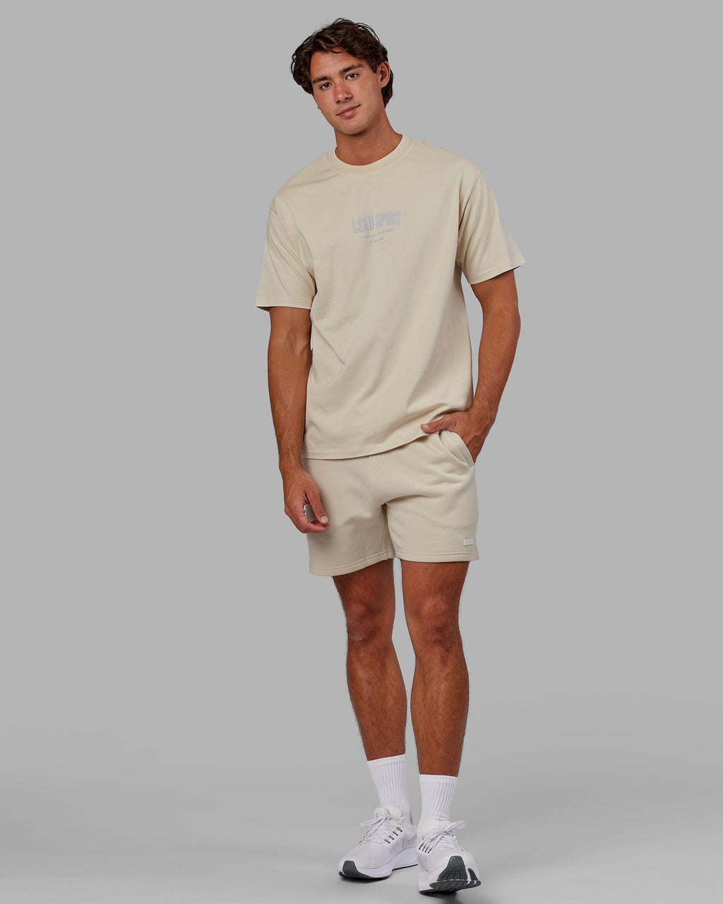 Model wearing Fundamental Track Short - Bone