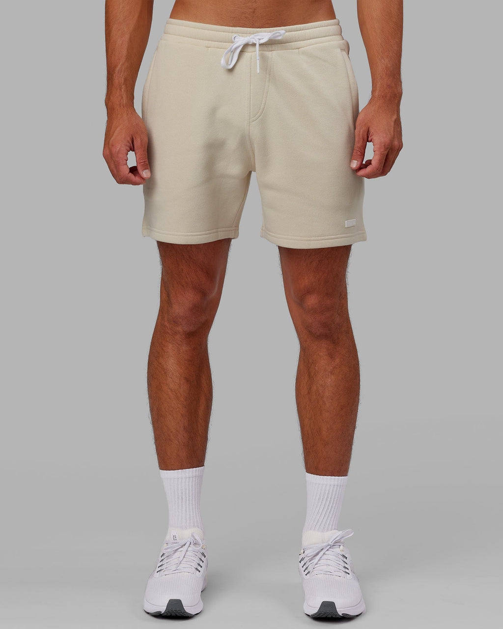 Model wearing Fundamental Track Short - Bone