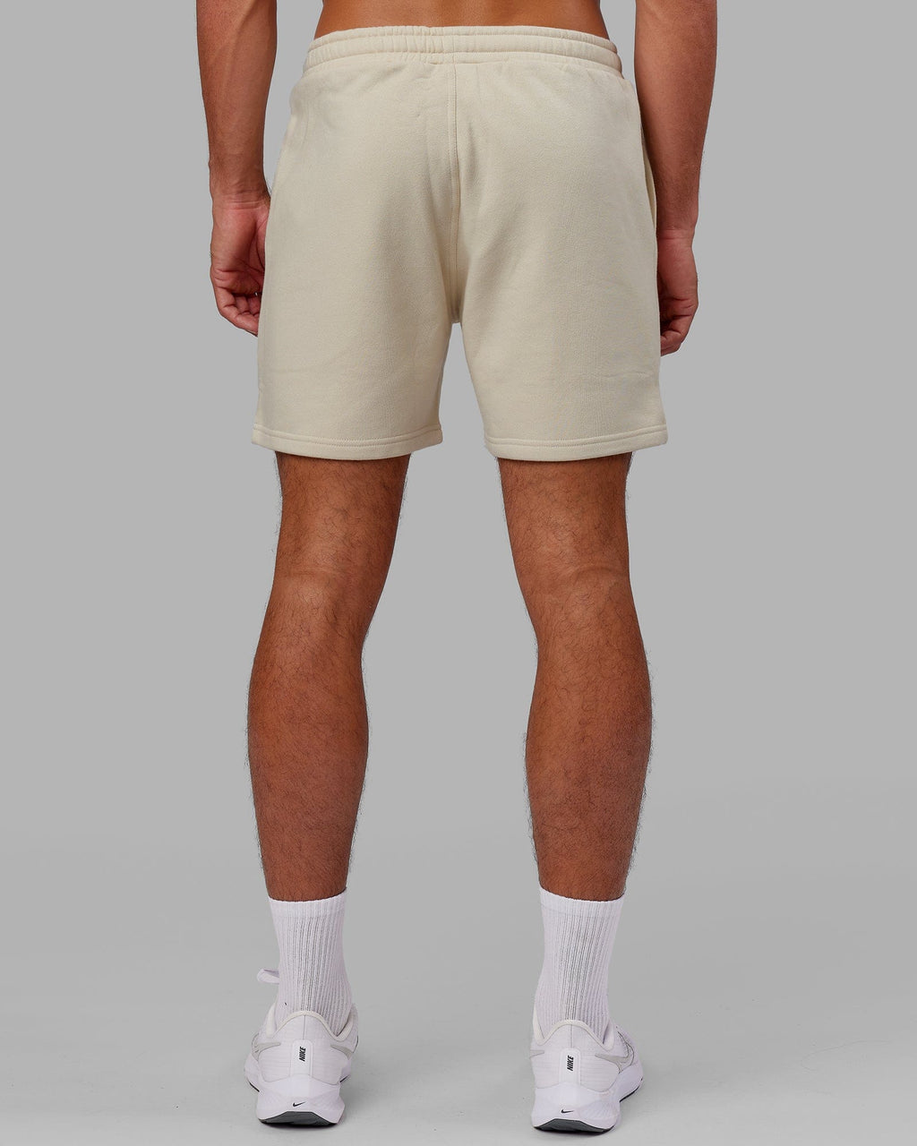 Model wearing Fundamental Track Short - Bone