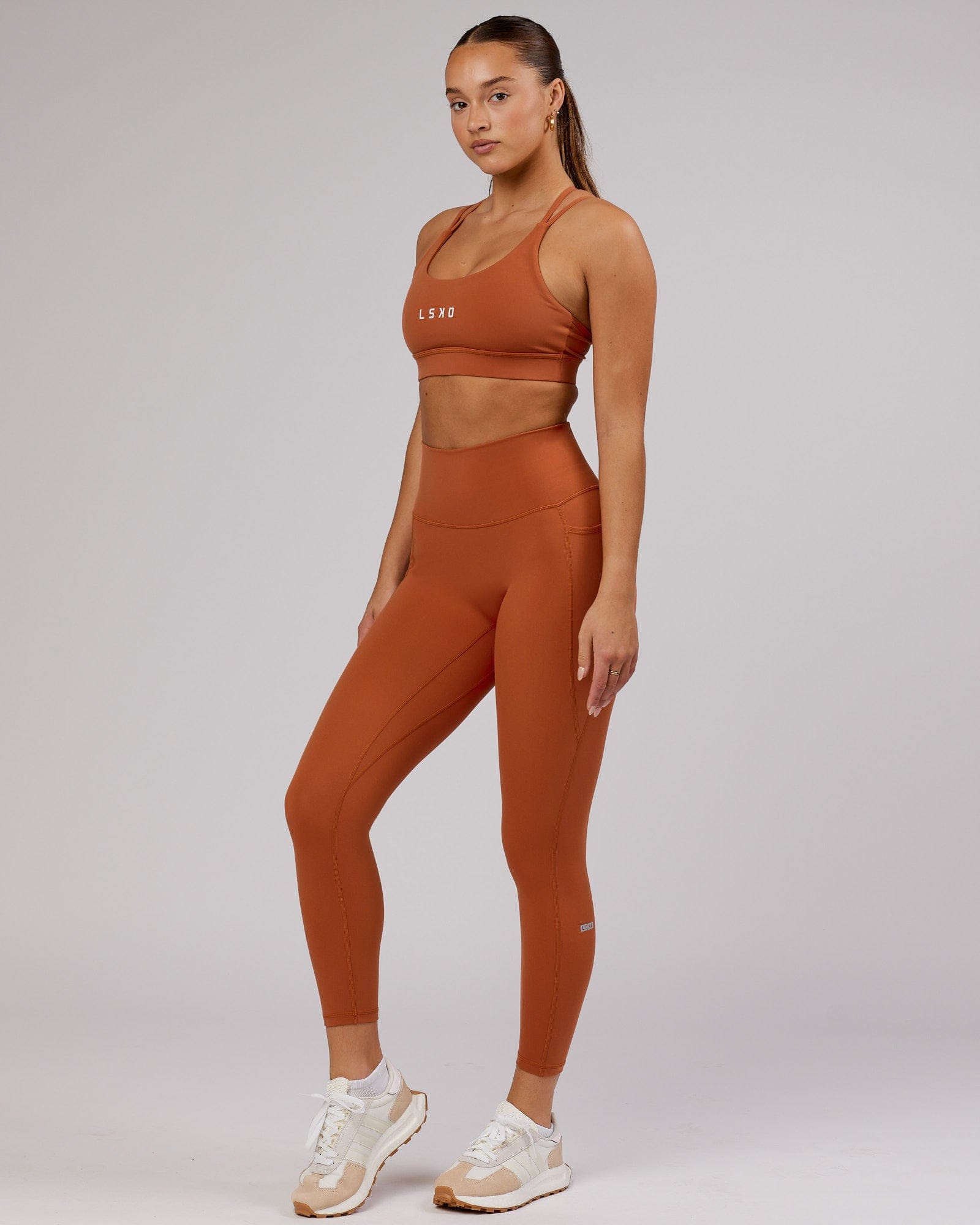 Model wearing Fusion 7/8 Length Tight - Auburn