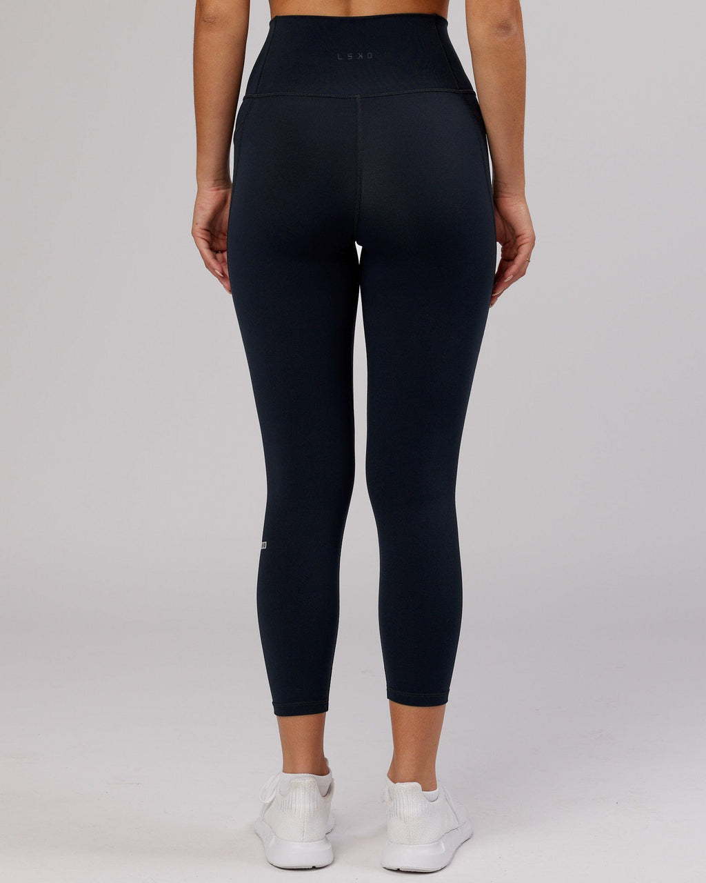 Model wearing Fusion 7/8 Length Tight - Navy