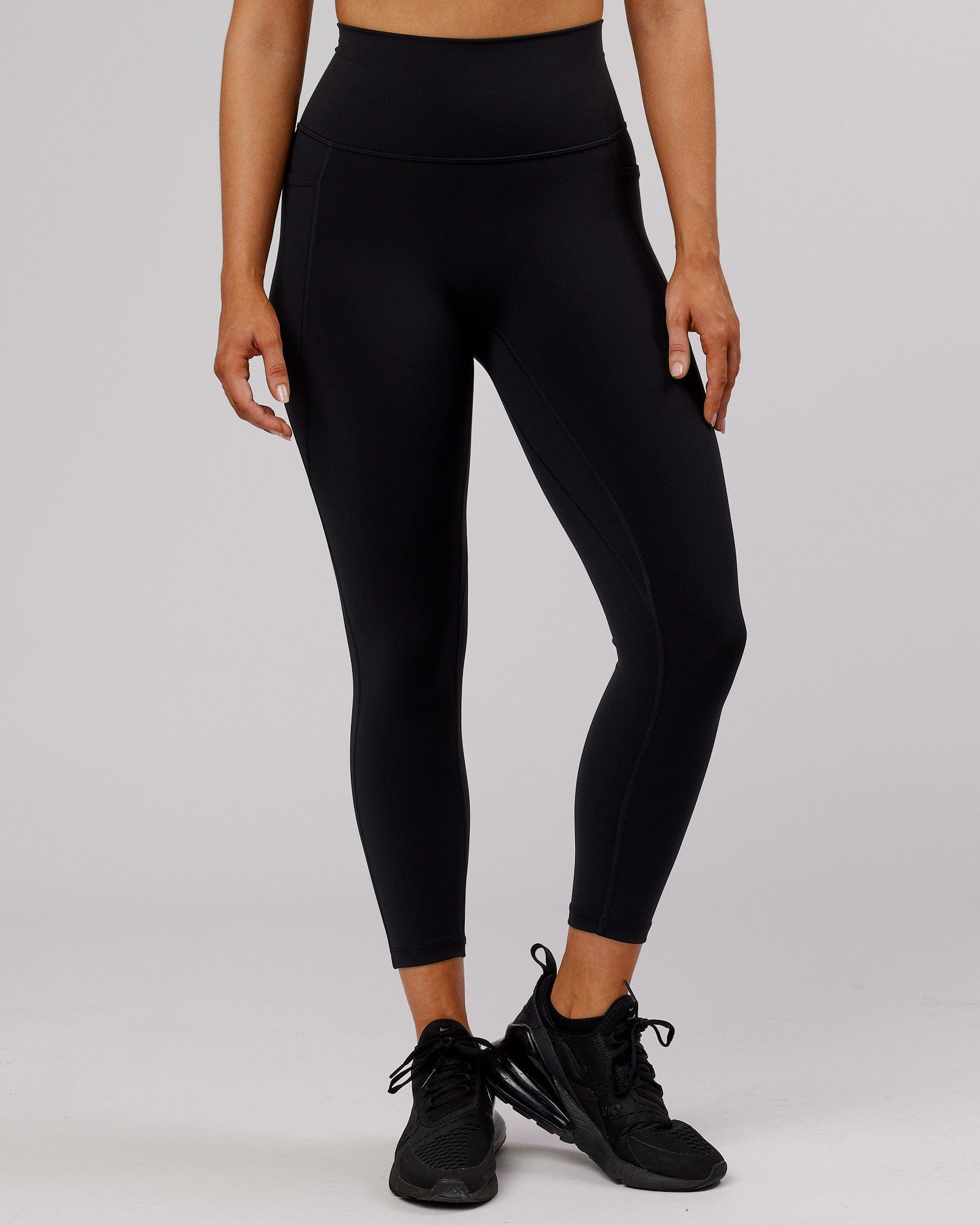 Model wearing Fusion 7/8 Length Tight - Black-Flamingo