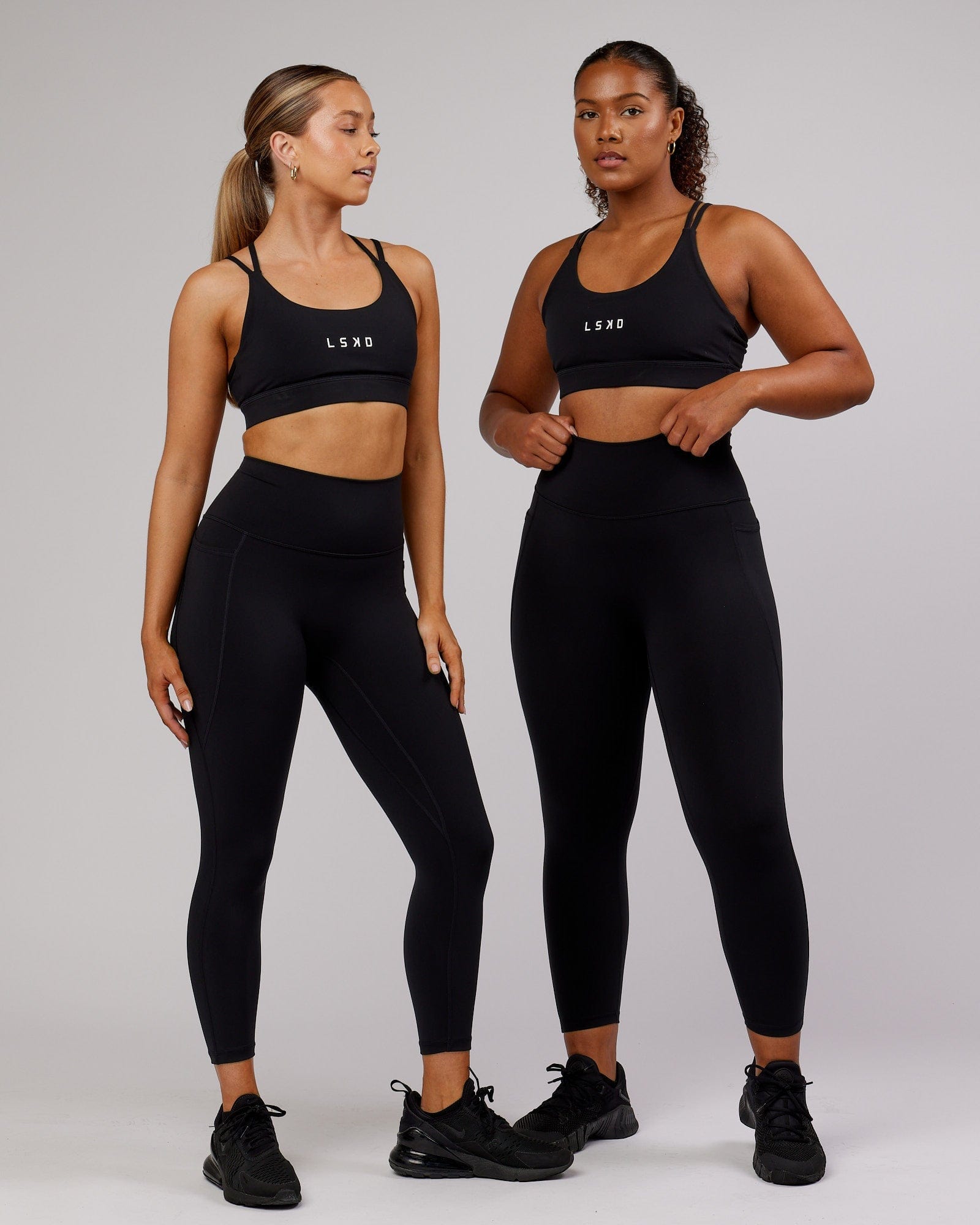 Model wearing Fusion 7/8 Length Tight - Black-Flamingo