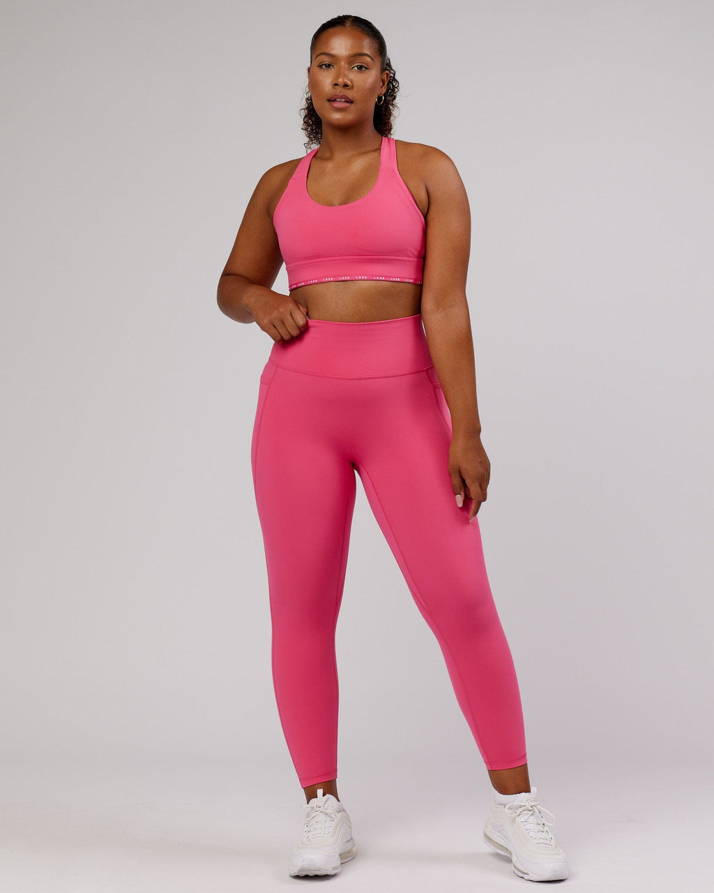 Model wearing Fusion 7/8 Length Tight - Flamingo